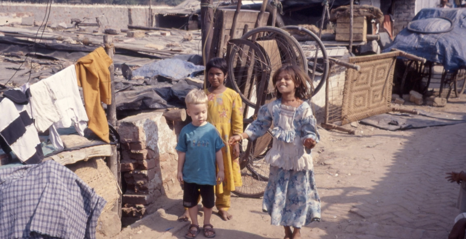Tom as a 3 year old playing in the alleyway outside our home (out of view on the right), with his friend Sunita who lived in a house on the left.