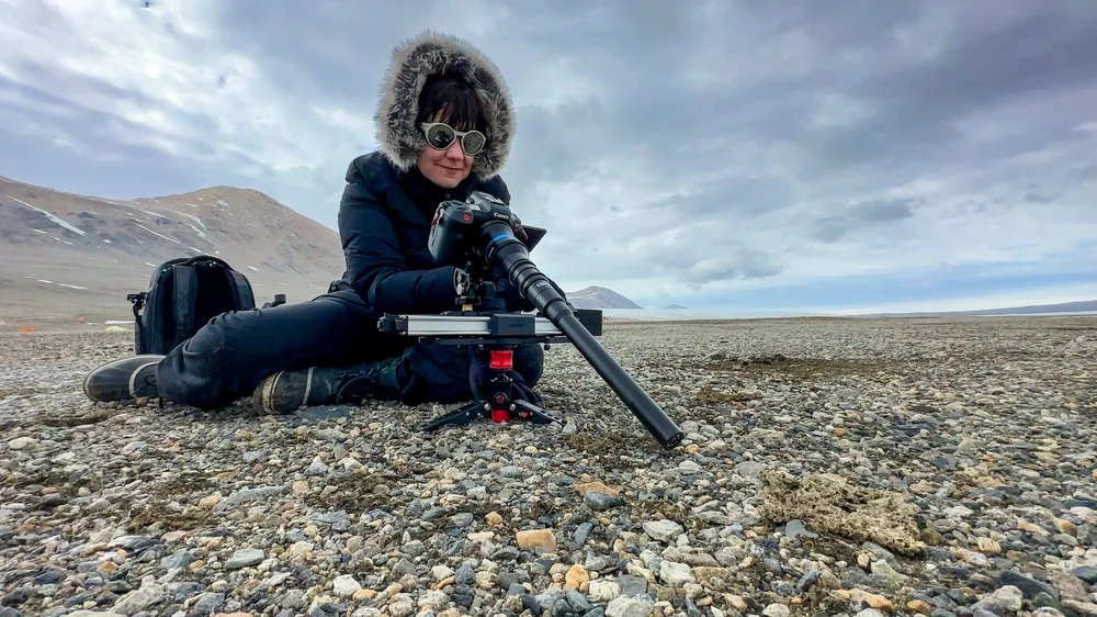 Ariel in Antarctica filming with her macro probe lens