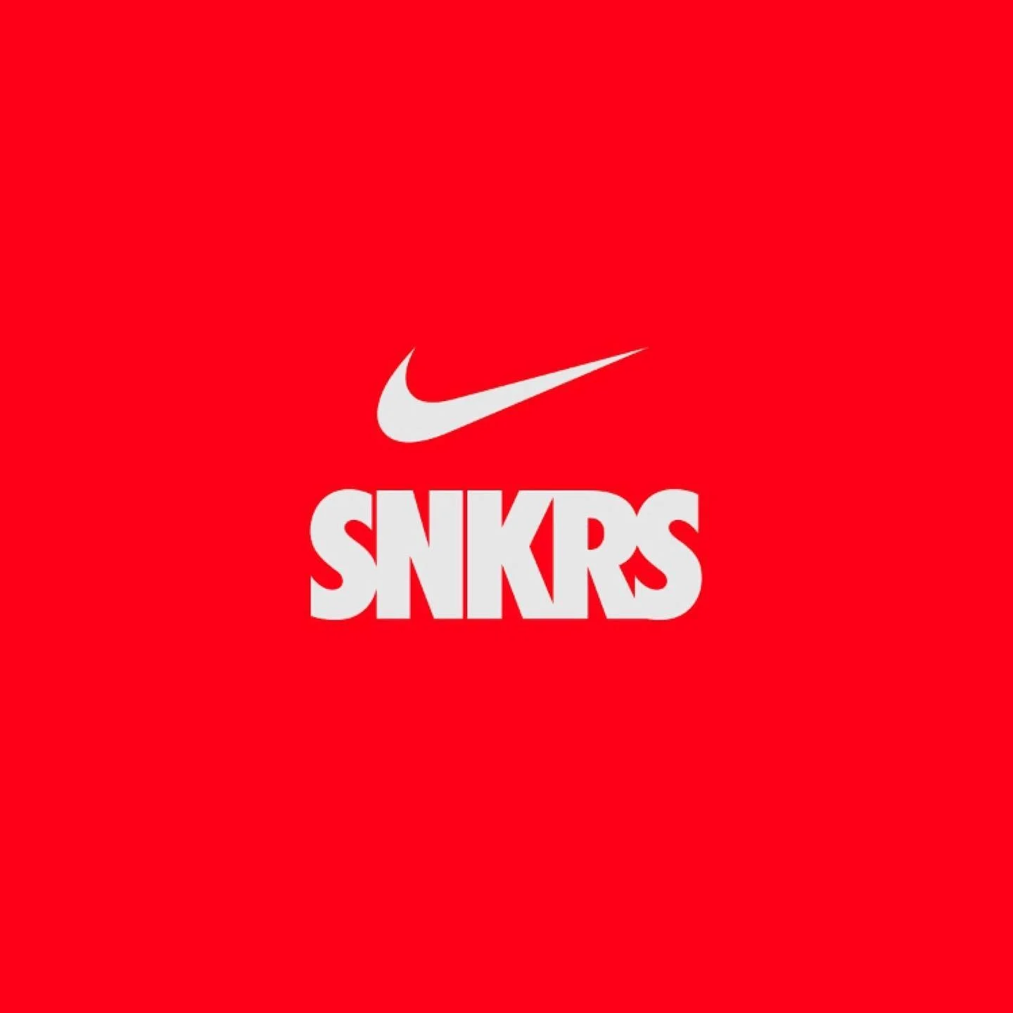 A red background featuring the Nike swoosh logo above large white text that reads 'SNKRS'.