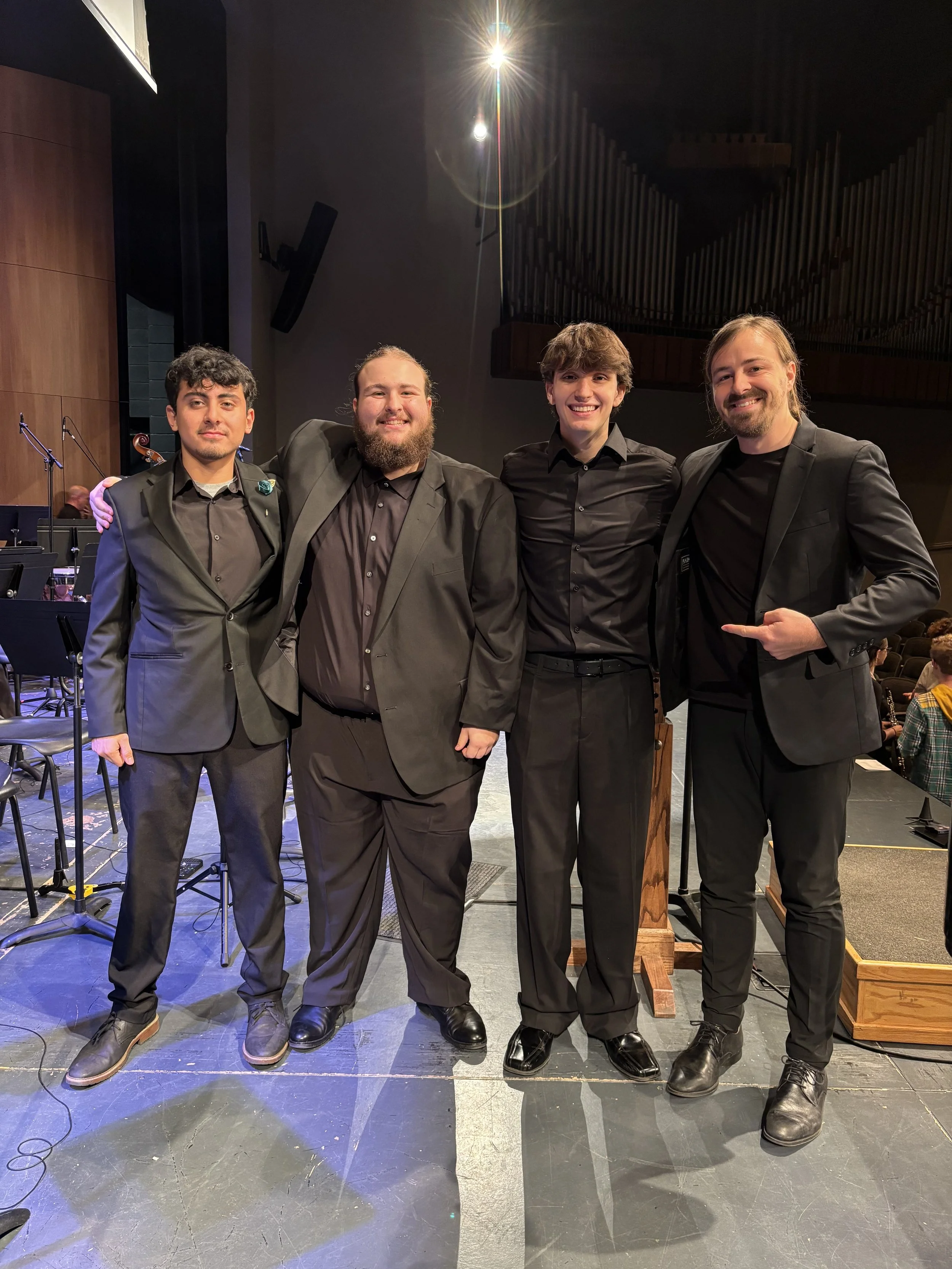  w/ students Kraigen, Emanuel and Miguel after a performance of “Re(new)al” w/ ATU Symphonic Wind Ensemble  