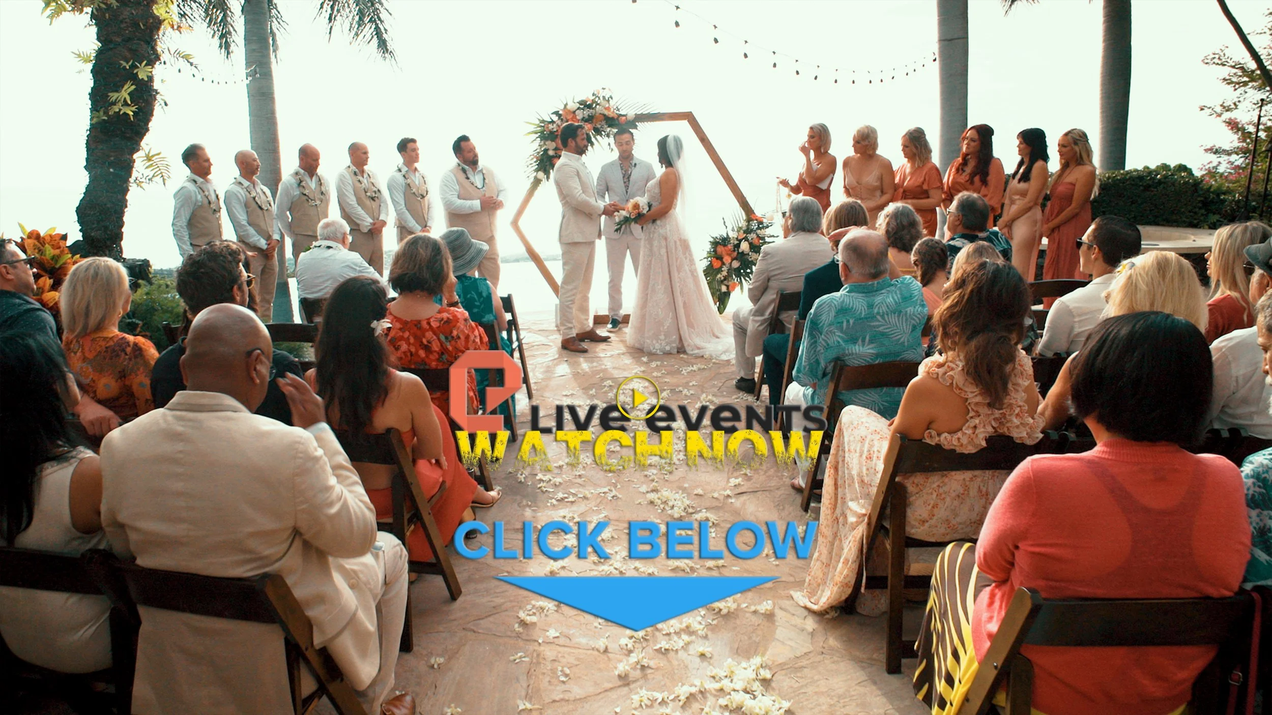 Outdoor wedding ceremony with bride and groom exchanging vows under a floral arch, surrounded by guests, palm trees, and string lights.