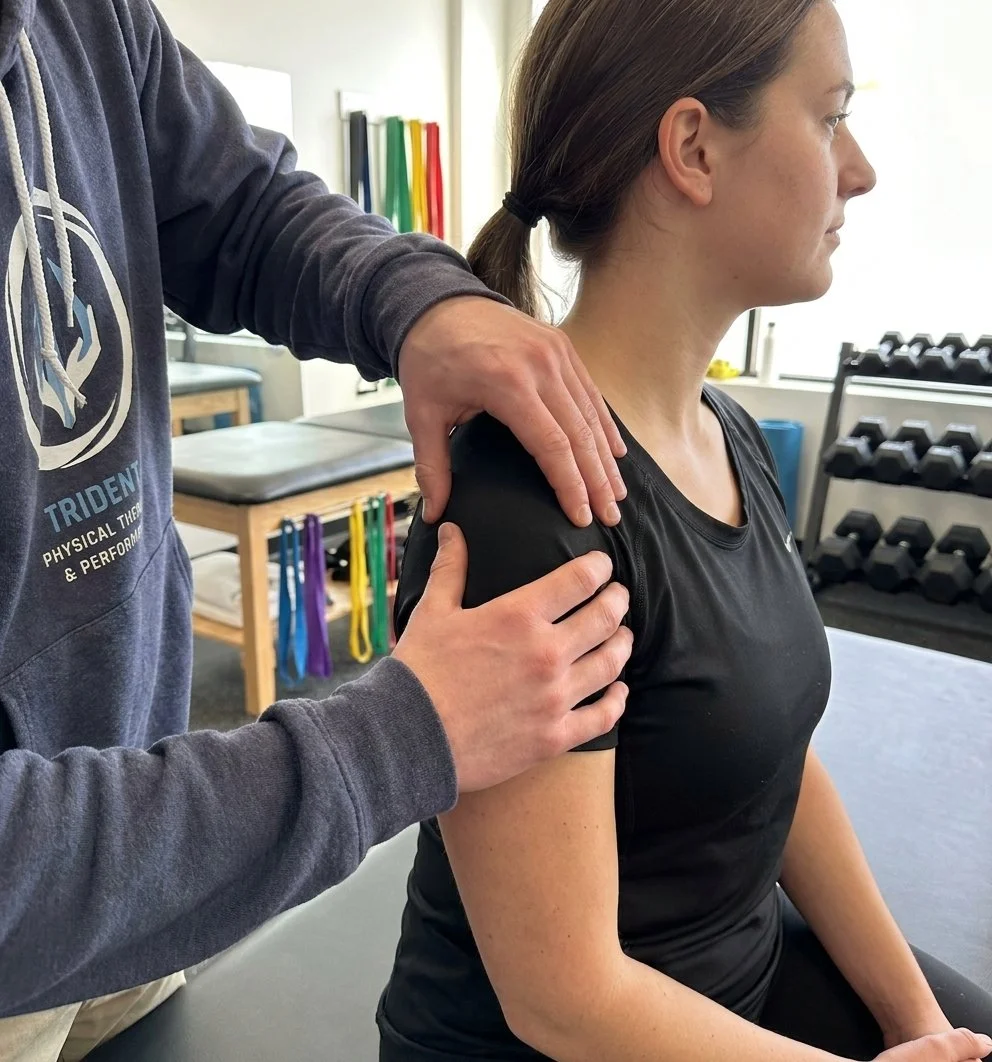 Patient working with a provider at a physical therapy clinic in Rockville Centre, NY during a shoulder manual therapy session