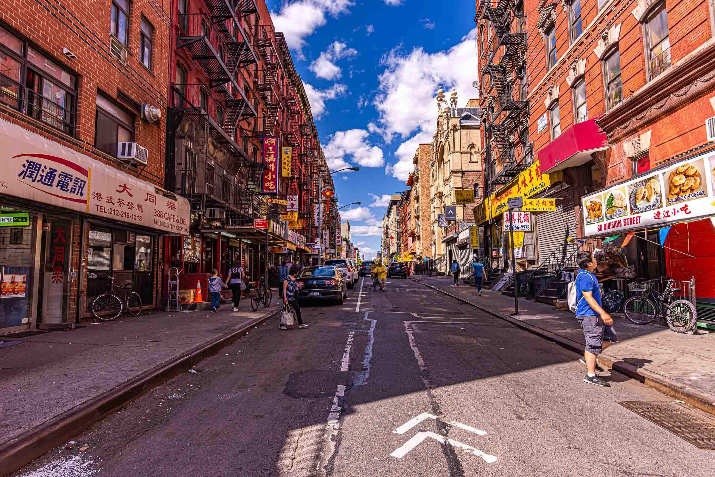 boy looking at a menu in chinatown