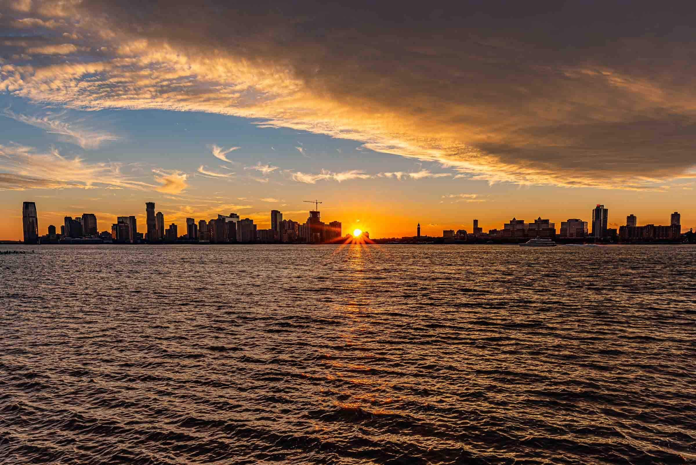 sun setting on a cityscape
