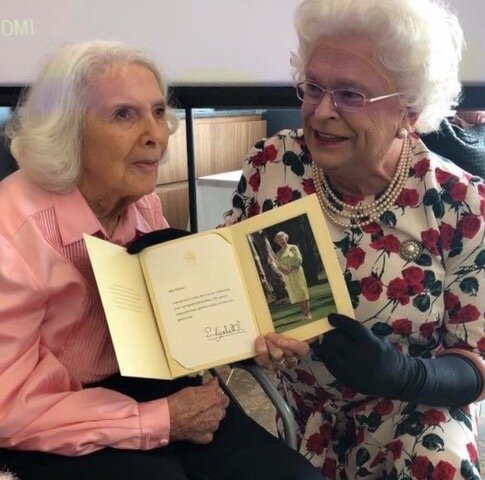 Elvie receiving her letter from Queen Elizabeth , as presented by our ‘other’ QE aka Gerry Connelly. She got such a laugh !