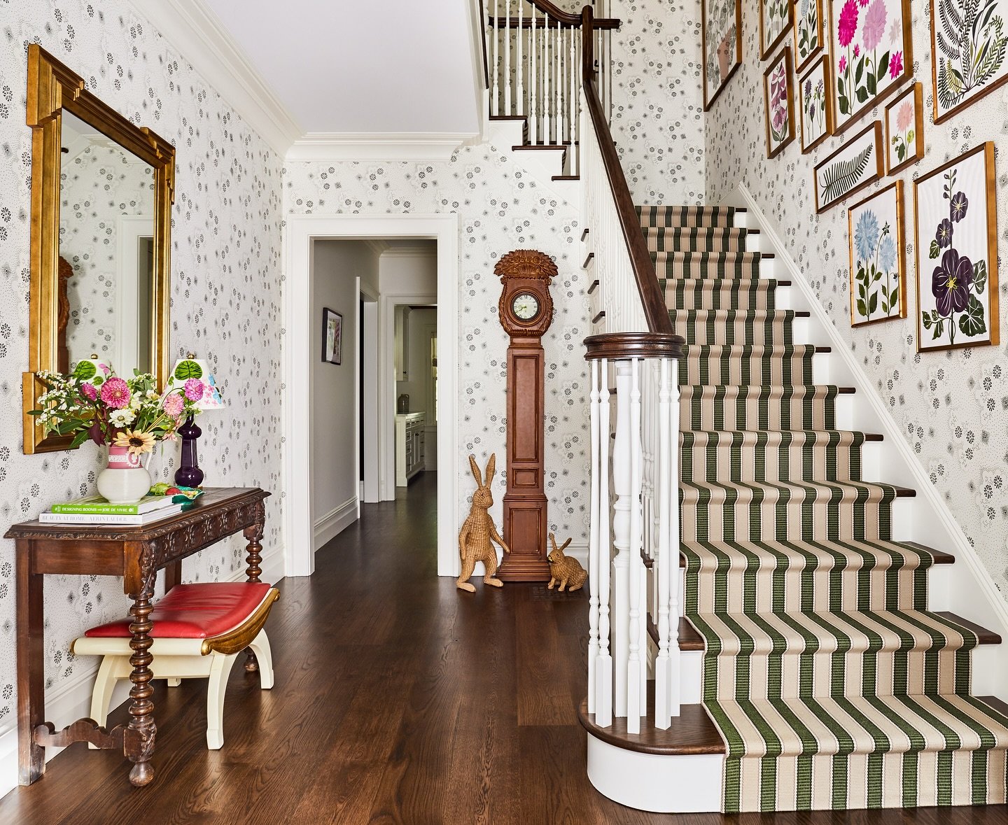 Starting the week with a dose of beauty in the entry hall at the home of @jenniferbeekhunter as featured by @housebeautiful .  With walls of our &ldquo;Happy&rdquo; wallpaper, this stair hall is classic mixed with a touch of whimsy - welcoming in eve