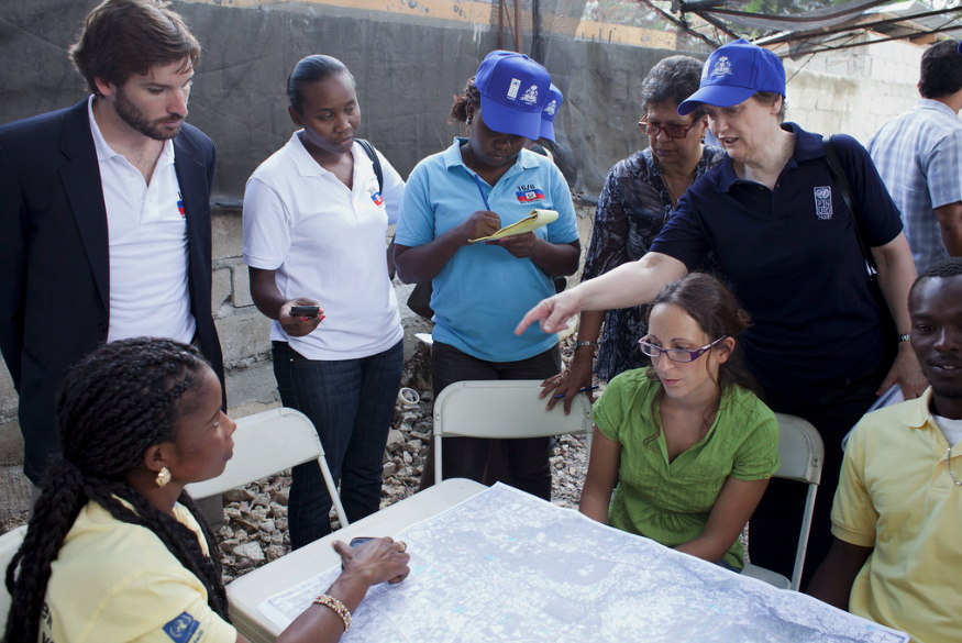 Helen Clark during her time at the UNDP talking to community leaders in Haiti, March 2012