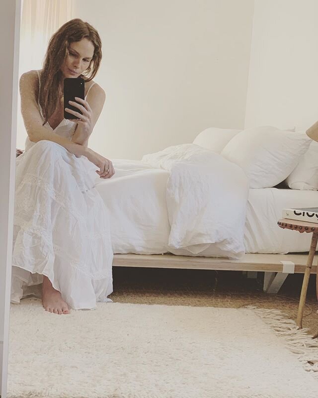 Nothing really. Just checking in and wanted to say hi 👋🏼. Blending in nicely over here with my @wakeupwright bedding, one of our partners for @mckinleybungalows. I never actually made it outside in this dress because it&rsquo;s freeeezing but nonet