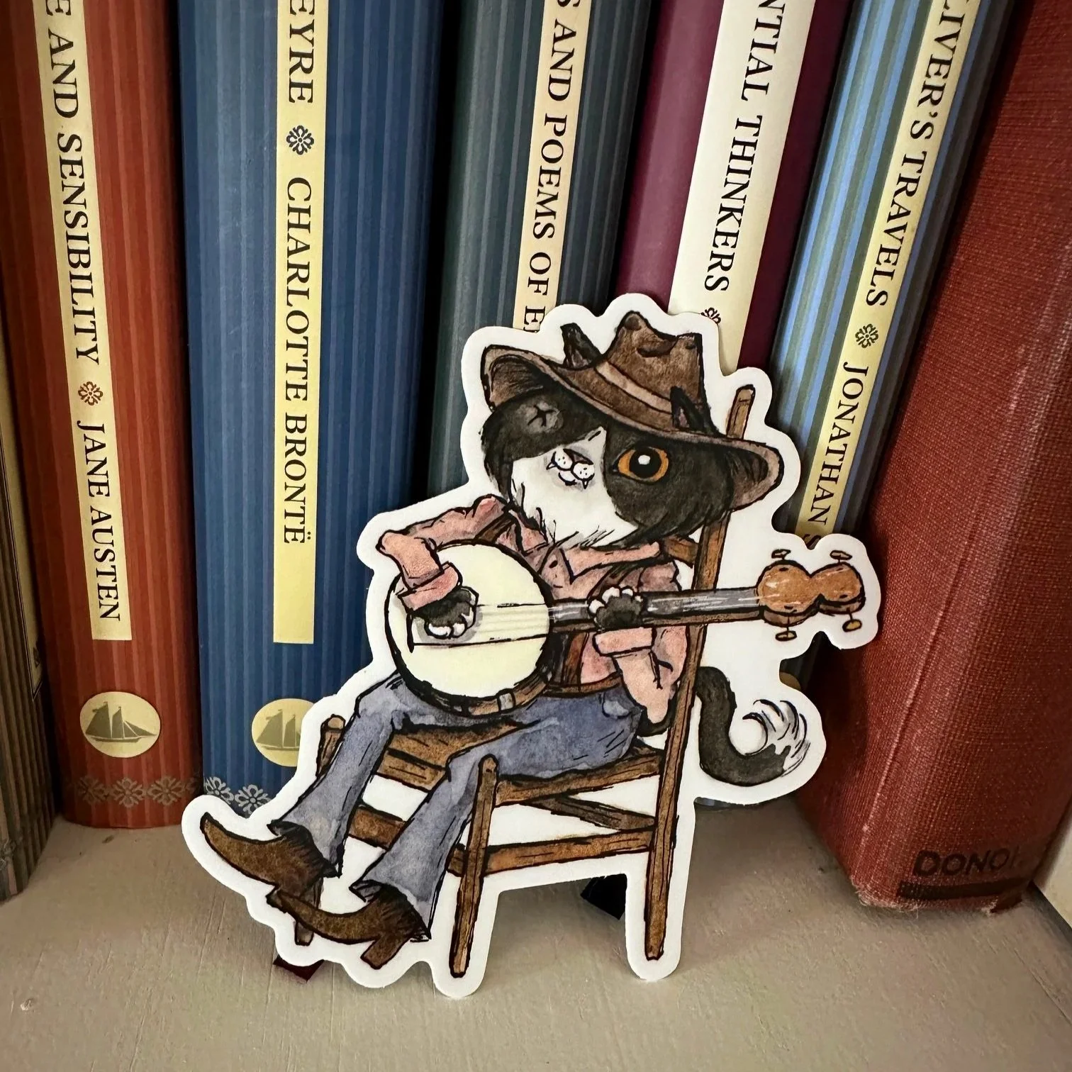 Cat playing banjo sticker. Durable cat sticker. Folk art sticker
