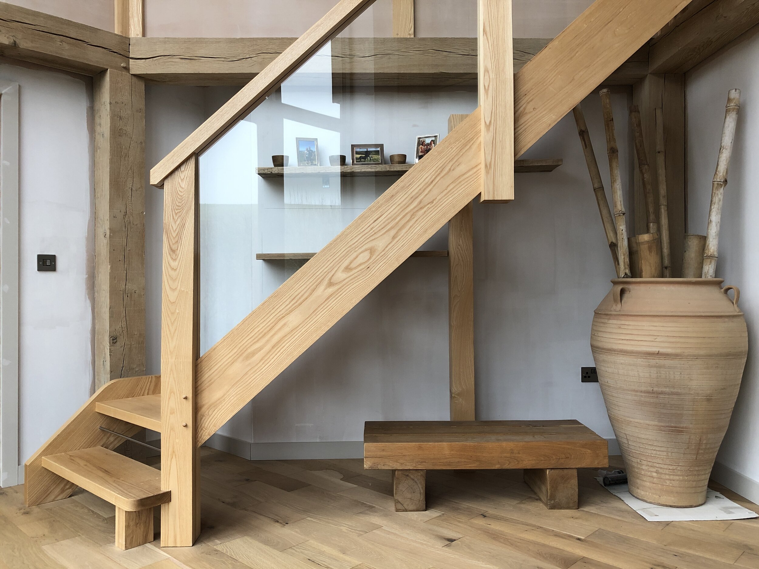 Interior with high quality timber staircase and glass balustrade