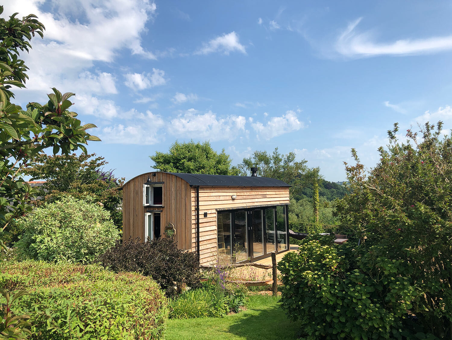 High quality bespoke cabin in Devon with Larch cladding and curved roof