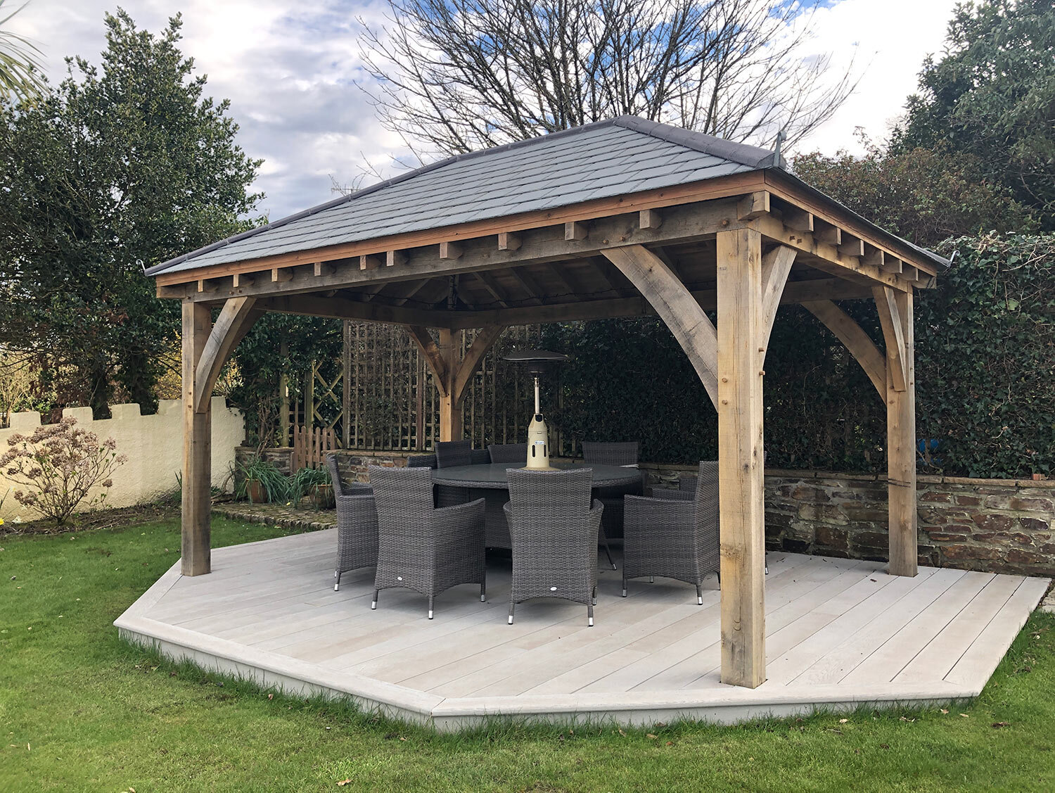Oak framed outdoor living and dining area with Millboard deck