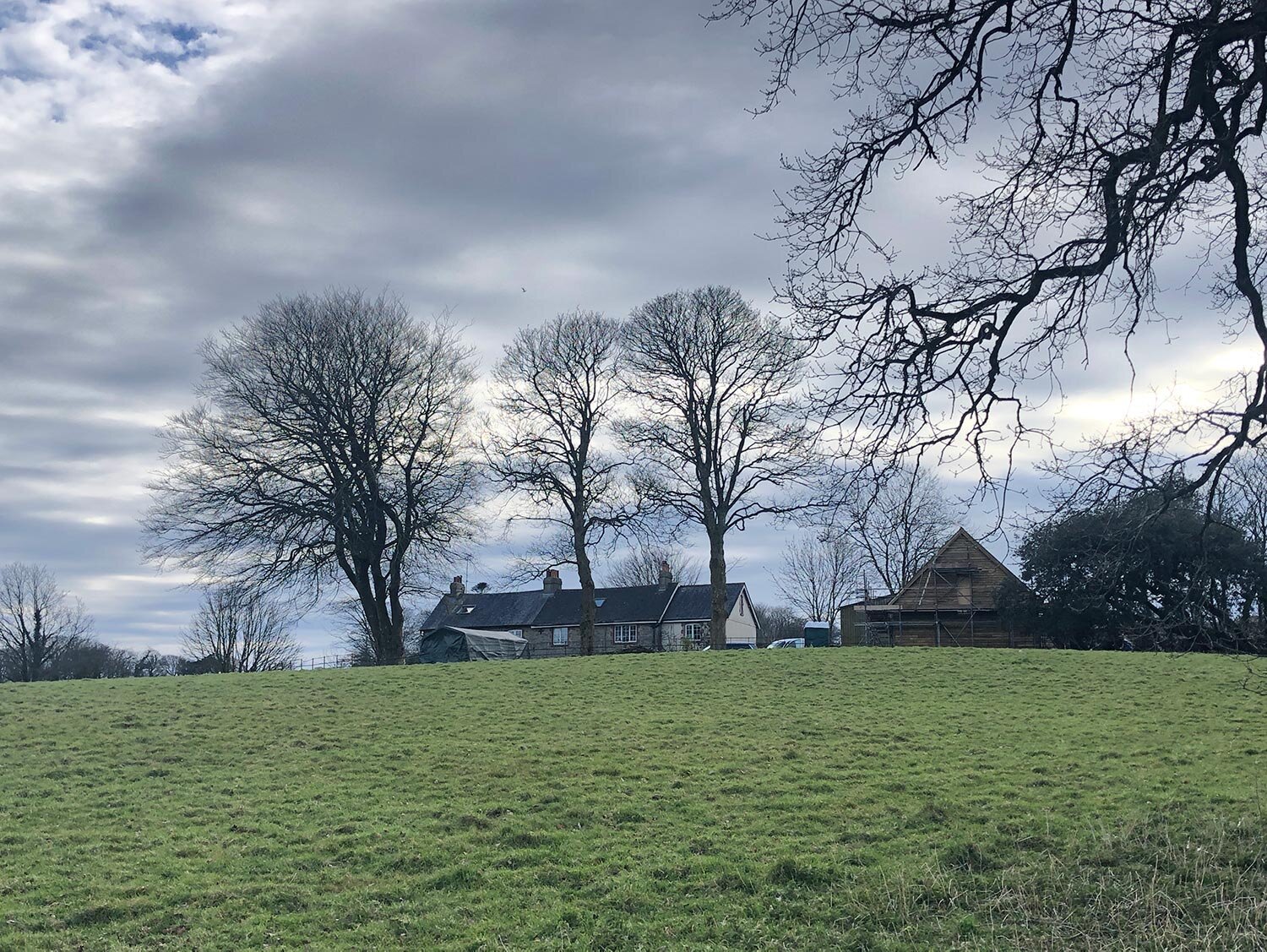 South Devon fields with timber garage in distance