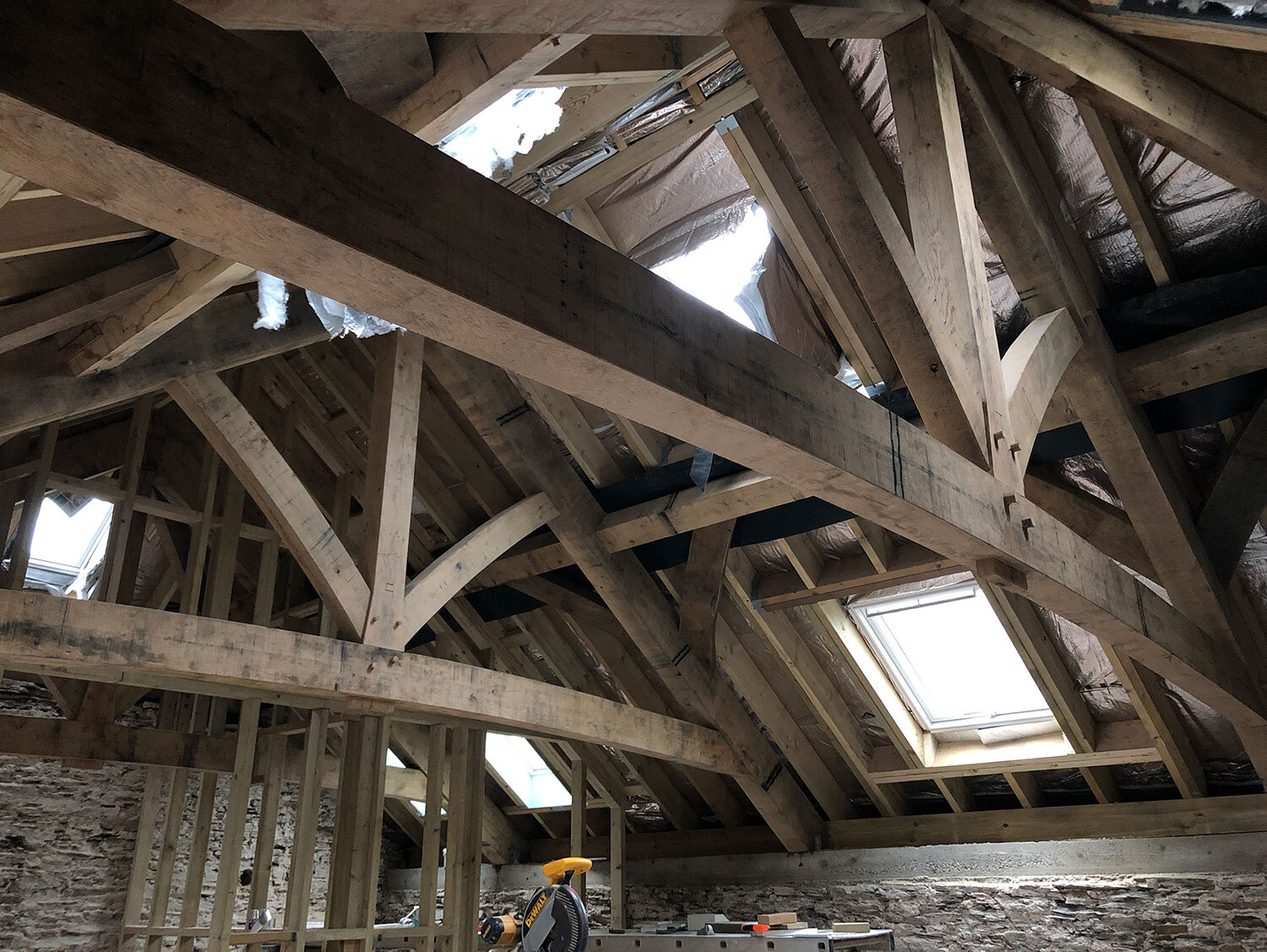 Timber framed roof and trusses with windows and insulation