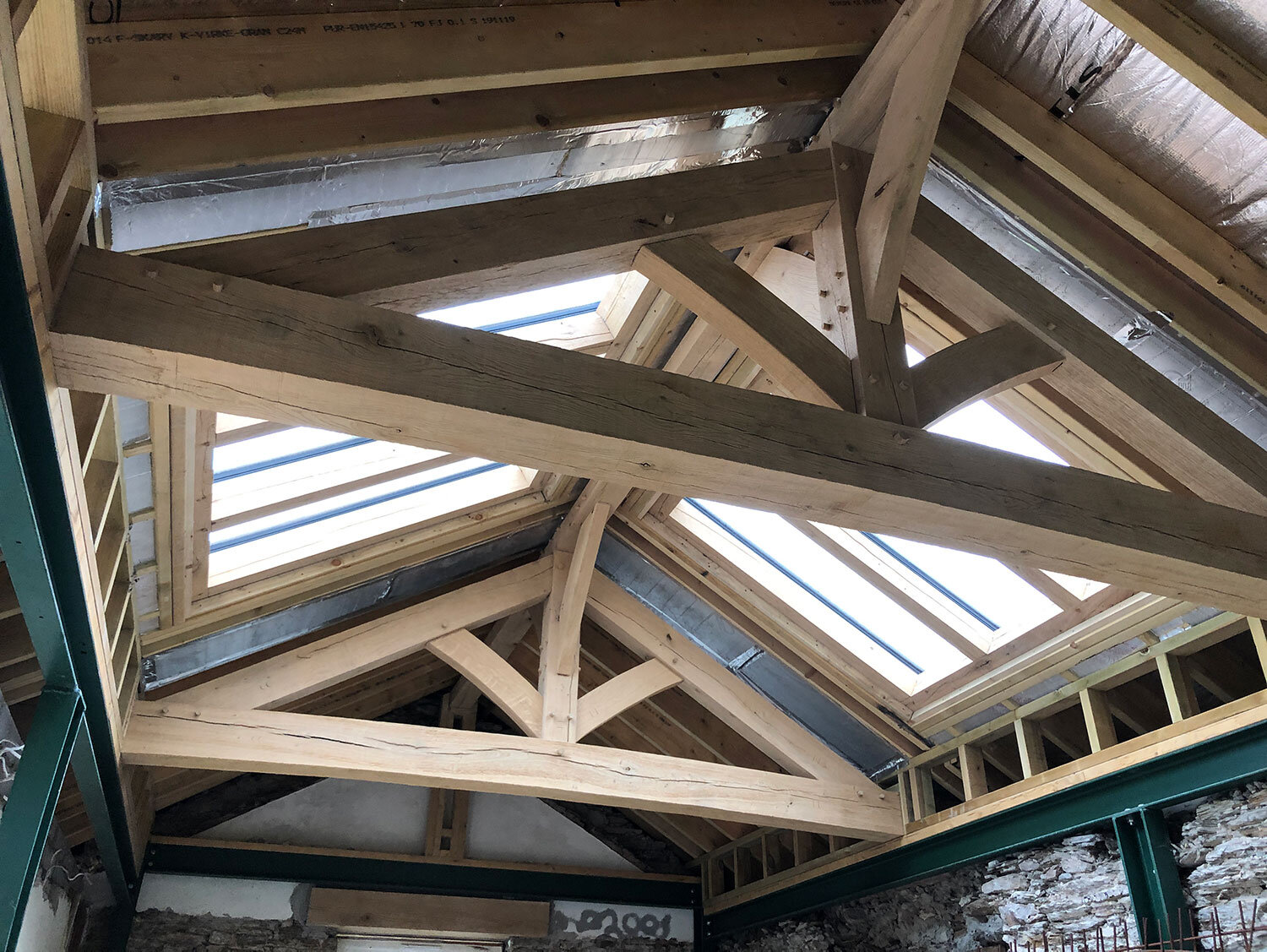 Completed oak and purlin framed roof for stone mill in Devon