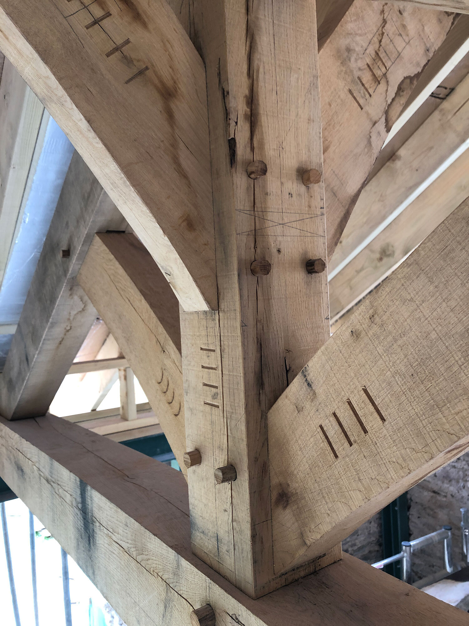 Close-up of green pegged oak joinery and truss