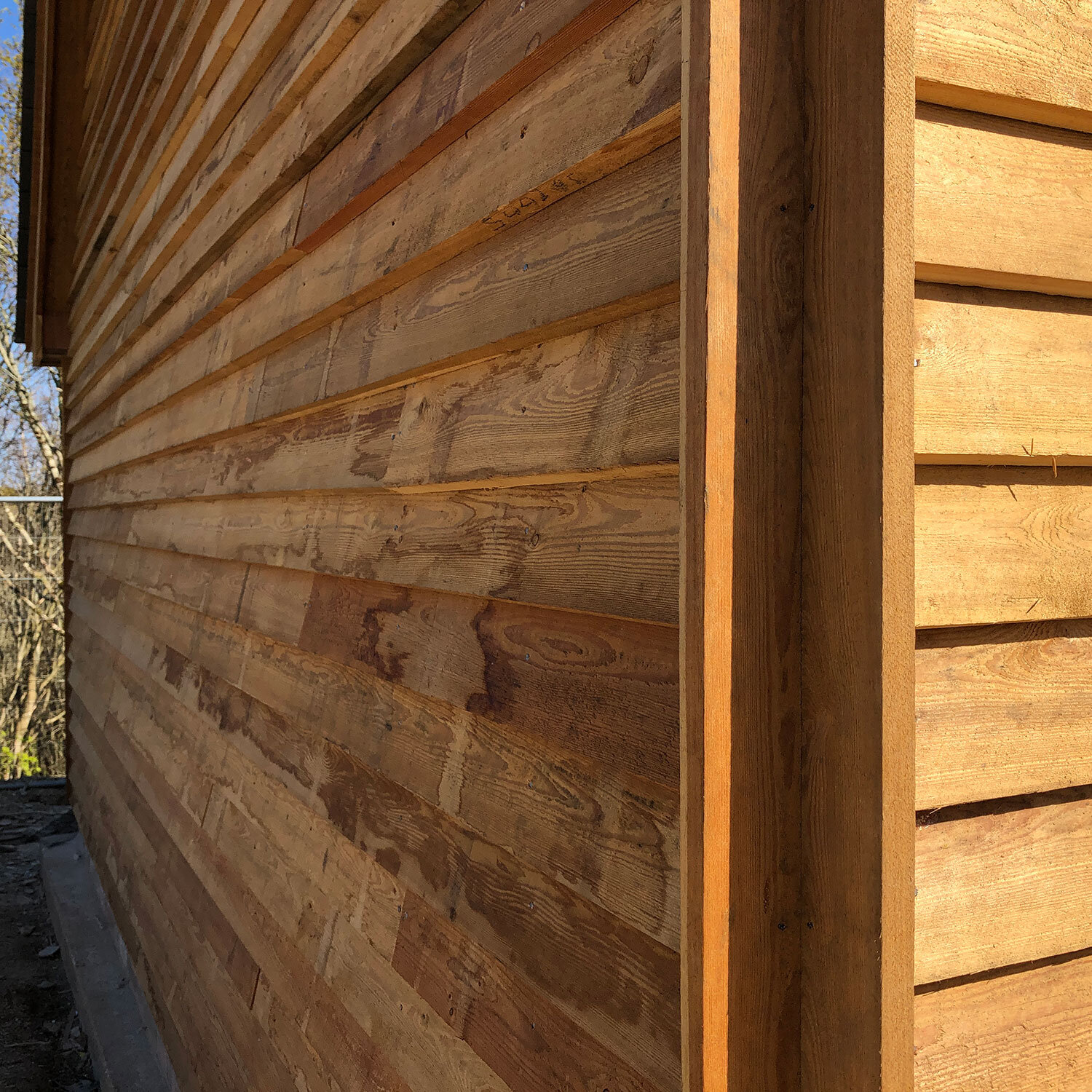 Corner detail of Larch cladding on building