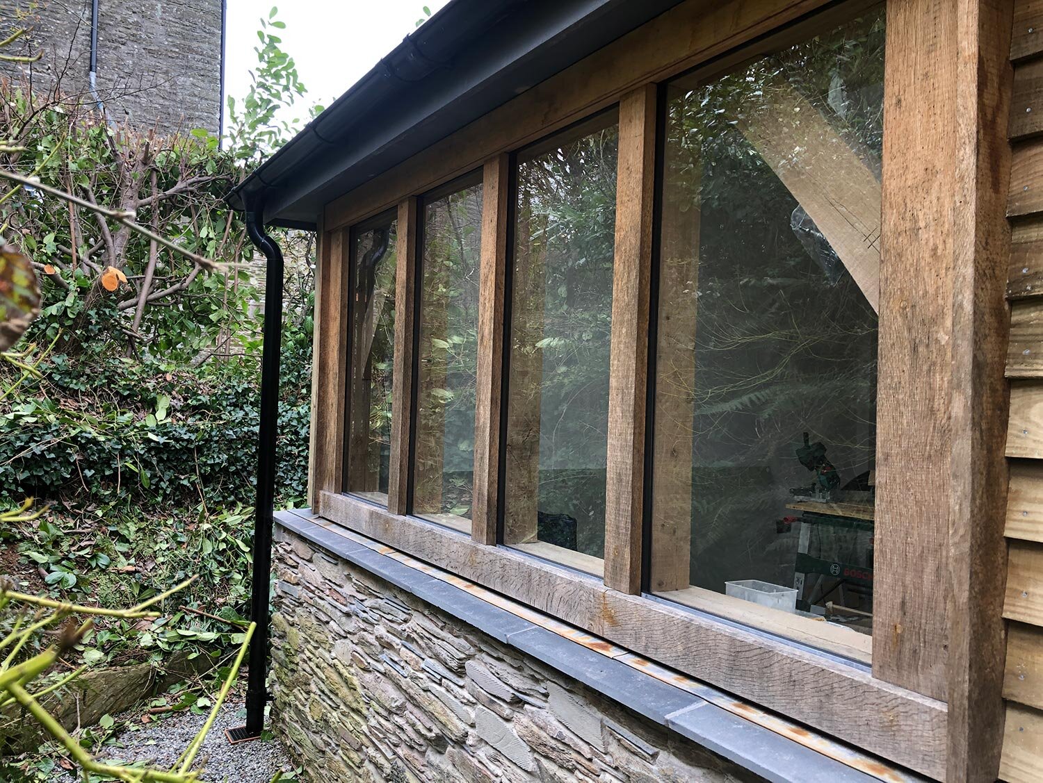 Stone-devon-cottage-extension-with-green-oak-glazing