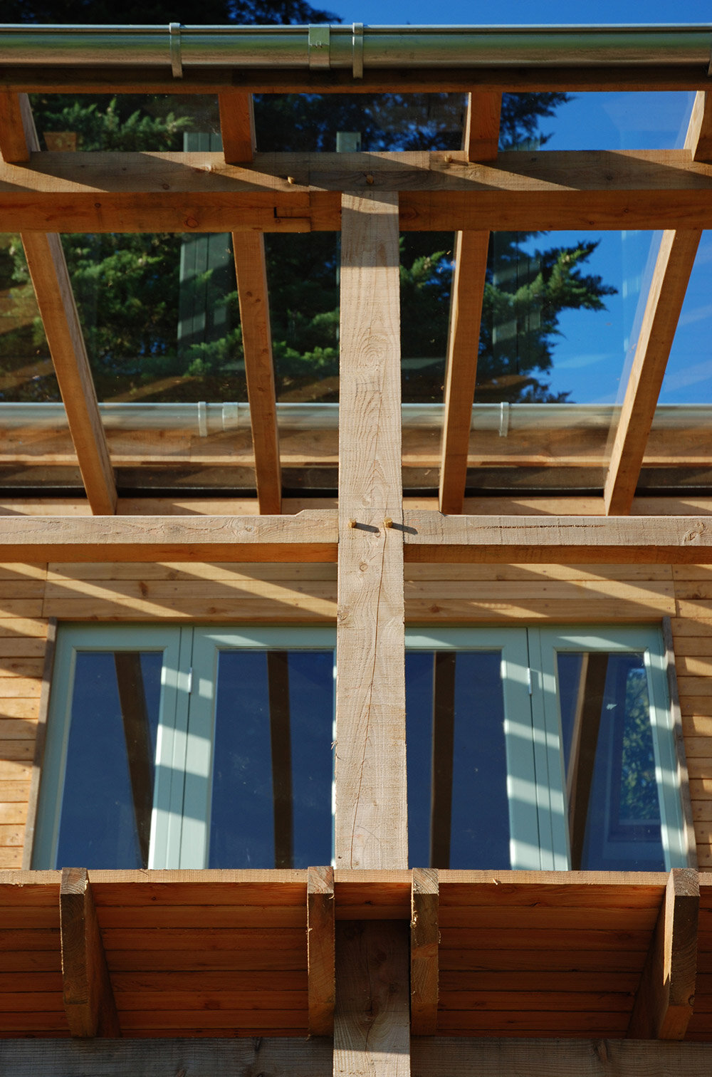 Detail of timber verandah overloking secluded Devon valley