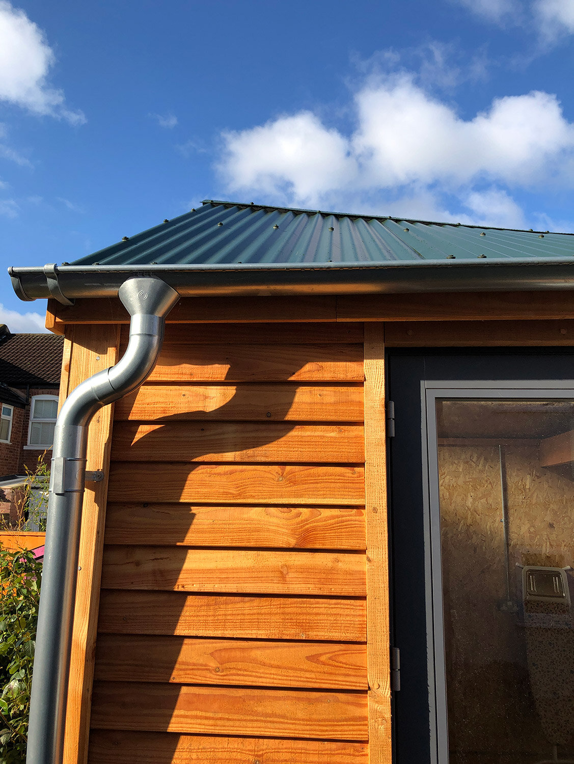 HUTI parabolic roof detail with Larch cladding