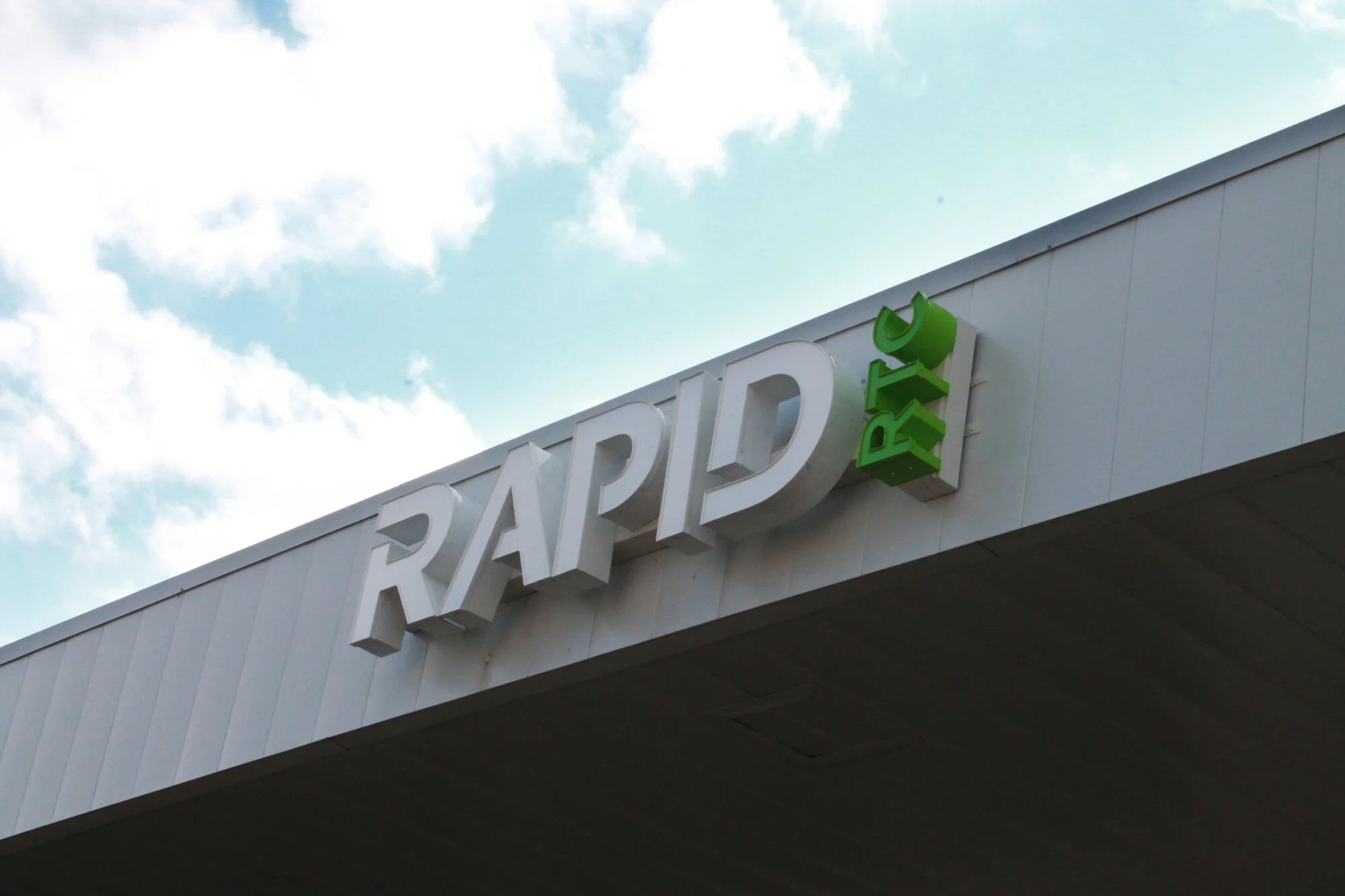 Signage on main office building facing Research Road