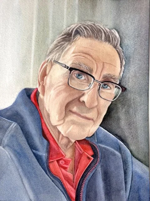 Portrait of an elderly man looking at the camera