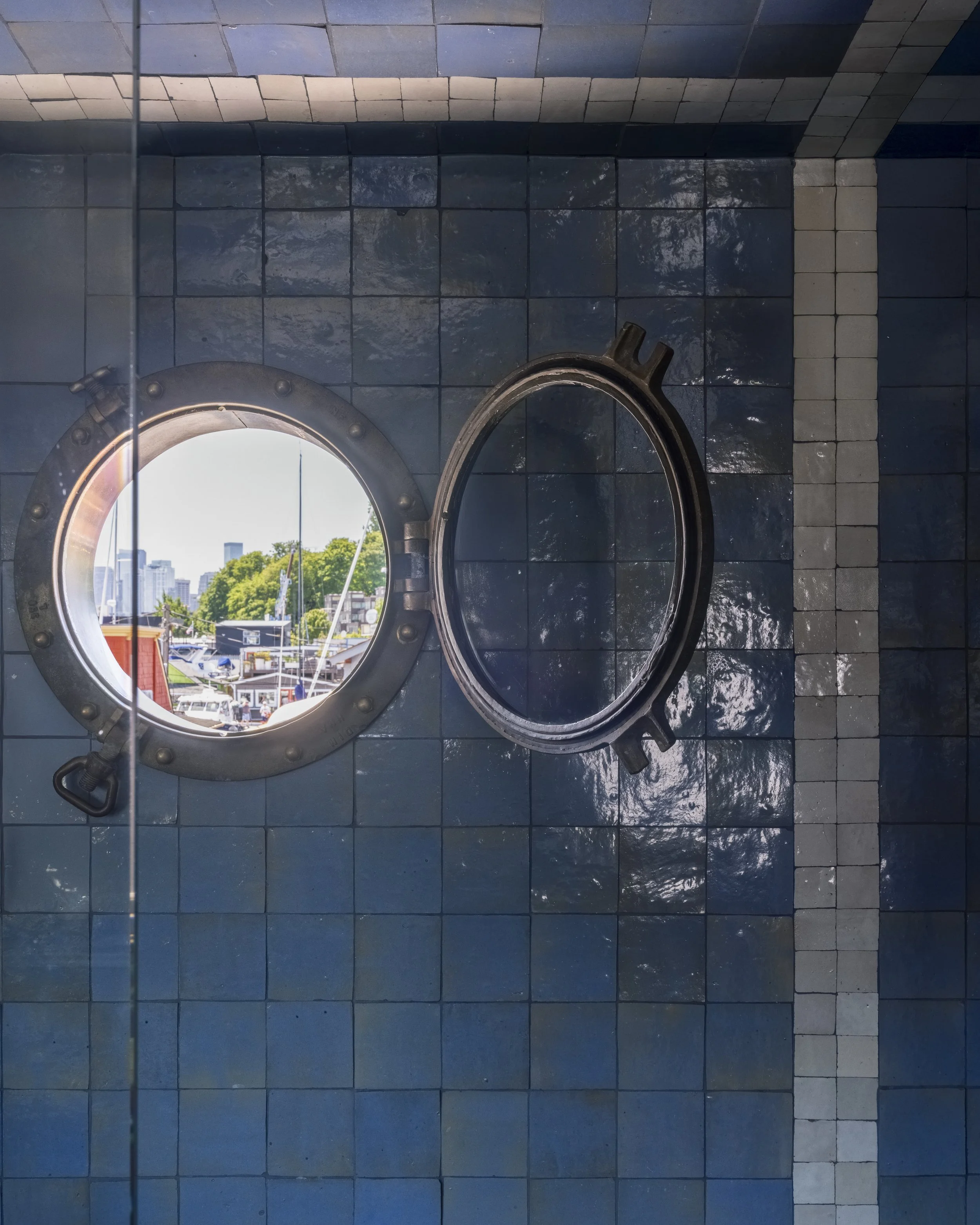 Nesika Chuck Floating Home | Seattle, WA

Architectural round window detail framed by textured blue tile, adding distinctive character to this Seattle floating home remodel.