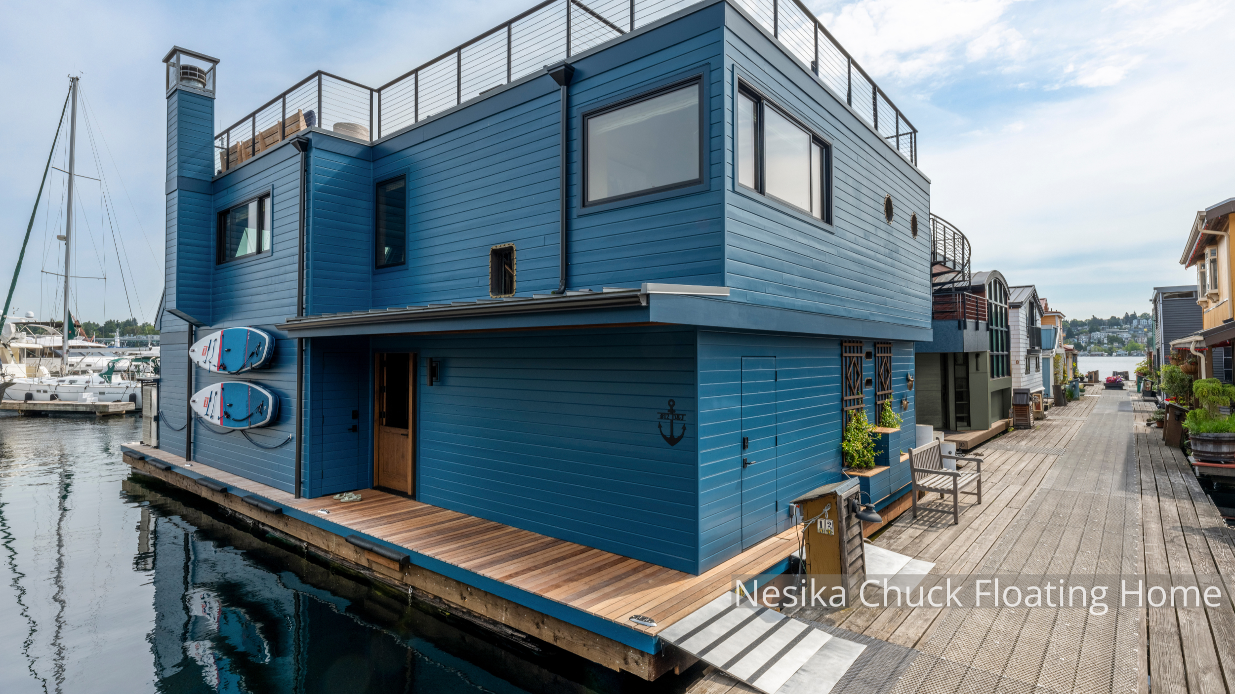Nesika Chuck Floating Home | Seattle, WA

A modern floating home on Lake Union designed for light, views, and seamless indoor–outdoor living. Clean contemporary lines, rooftop deck access, custom millwork, and exposed wood detailing create warmth wit