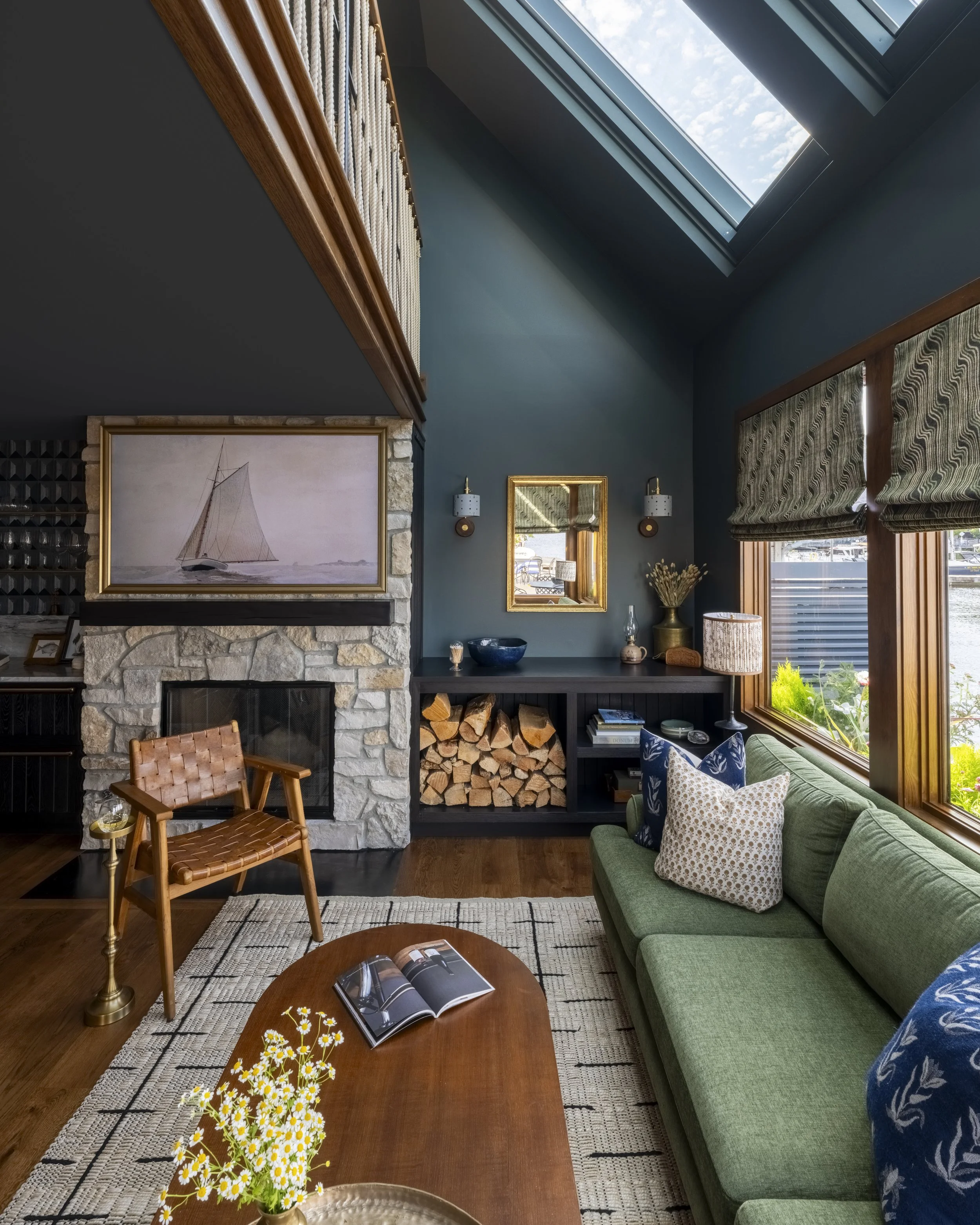 Nesika Chuck Floating Home | Seattle, WA

Double-height living room with green sectional, custom fireplace, and loft overlook enhancing vertical floating home design.