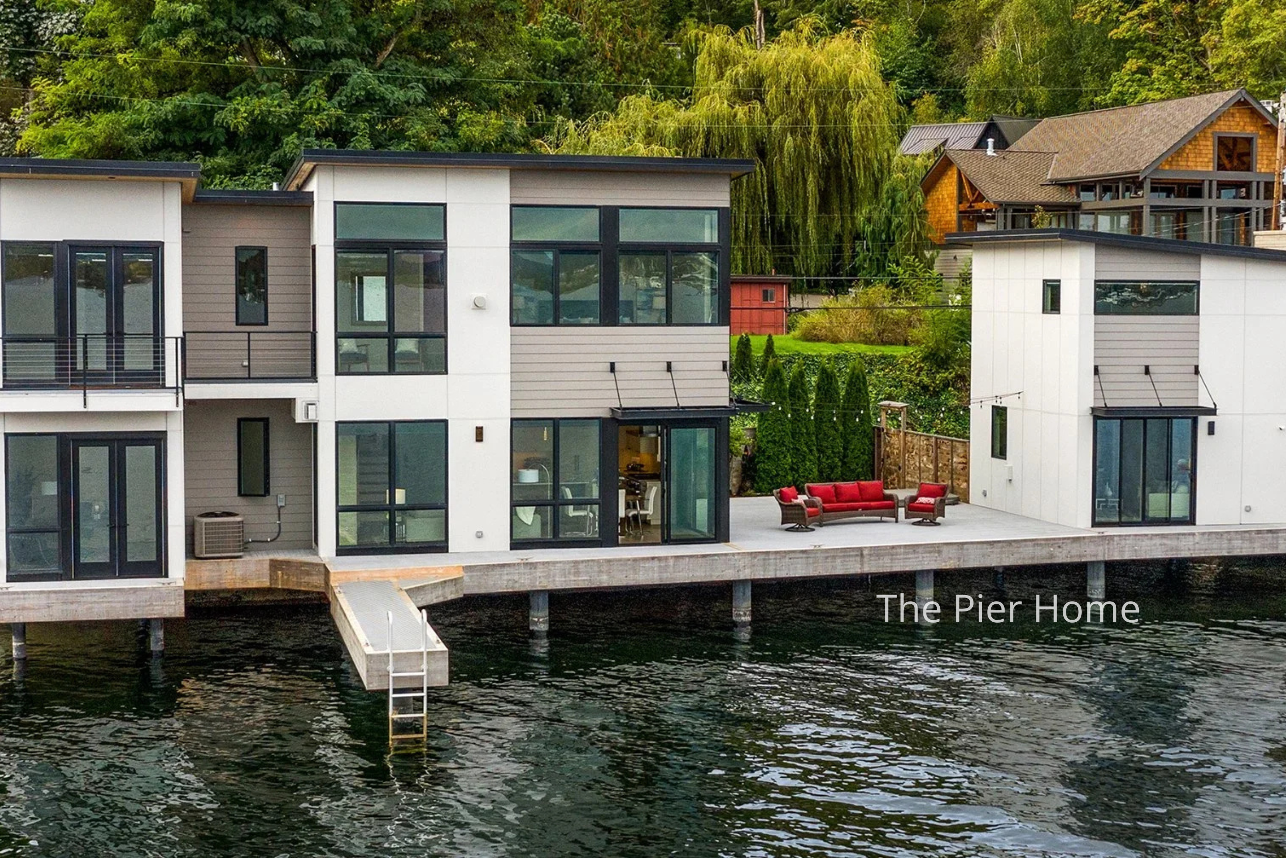 This Lake Washington New Home by ECCO Architecture features a modern waterfront residence designed to maximize lake access and outdoor living. Clean-lined volumes, expansive glazing, and direct dock connections create a seamless relationship between 