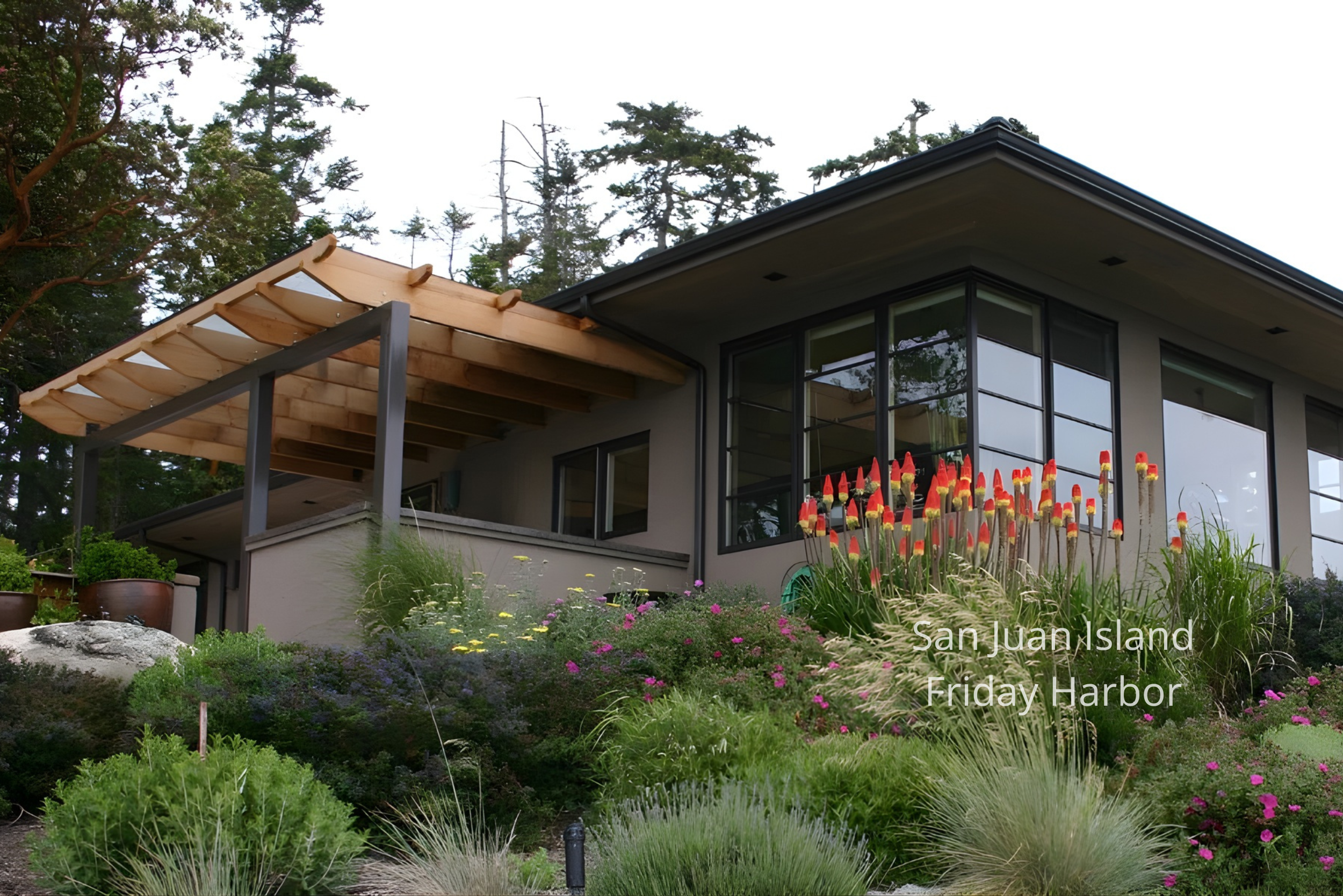 The San Juan Island New Home by ECCO Architecture blends contemporary design with the warmth of Northwest materials. Expansive windows frame panoramic views of the islands while natural textures, cedar detailing, and soft interior tones create a rela