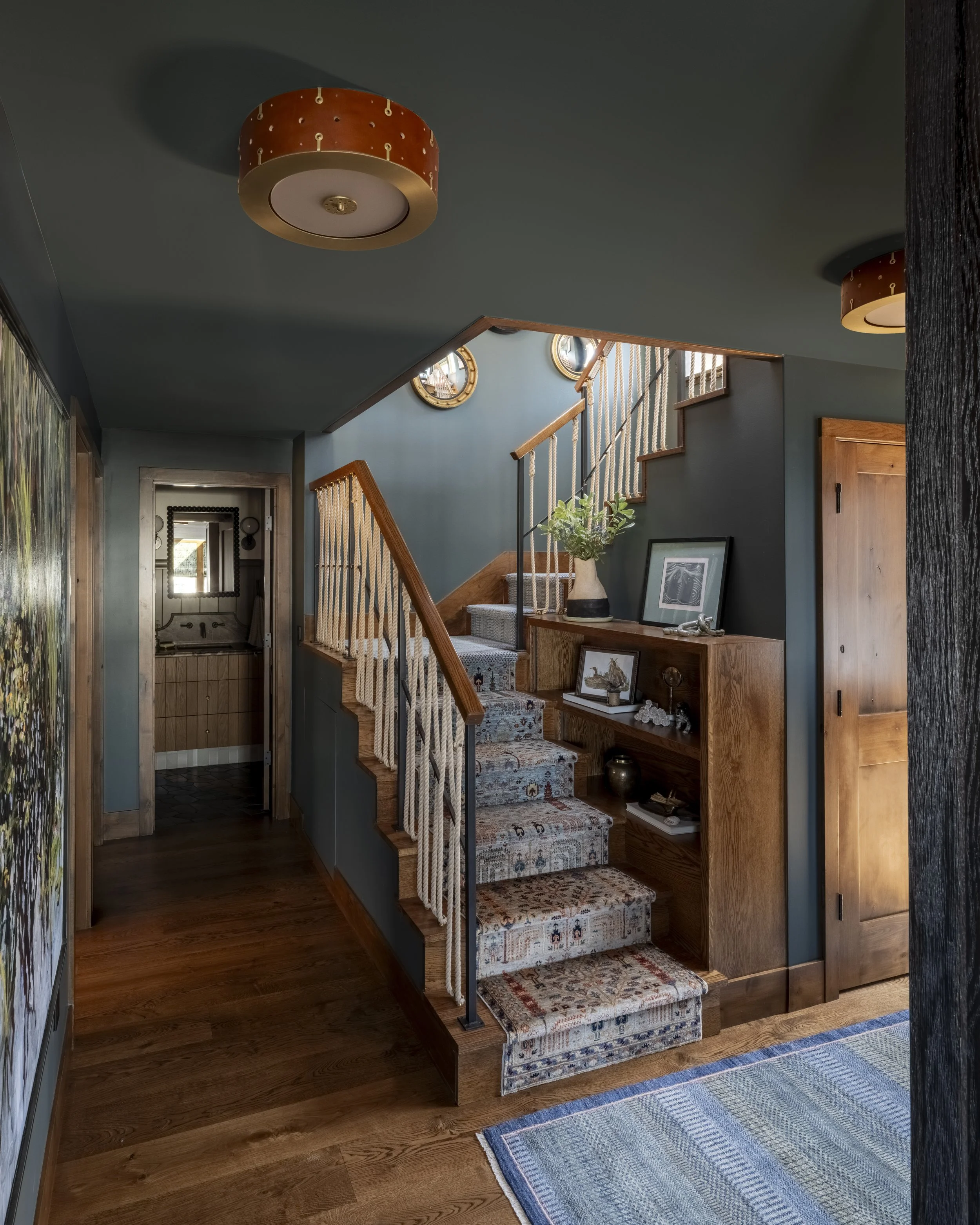 Nesika Chuck Floating Home | Seattle, WA

Warm interior detailing with custom stair design, wood accents, and rich finishes reflecting timeless floating home character.