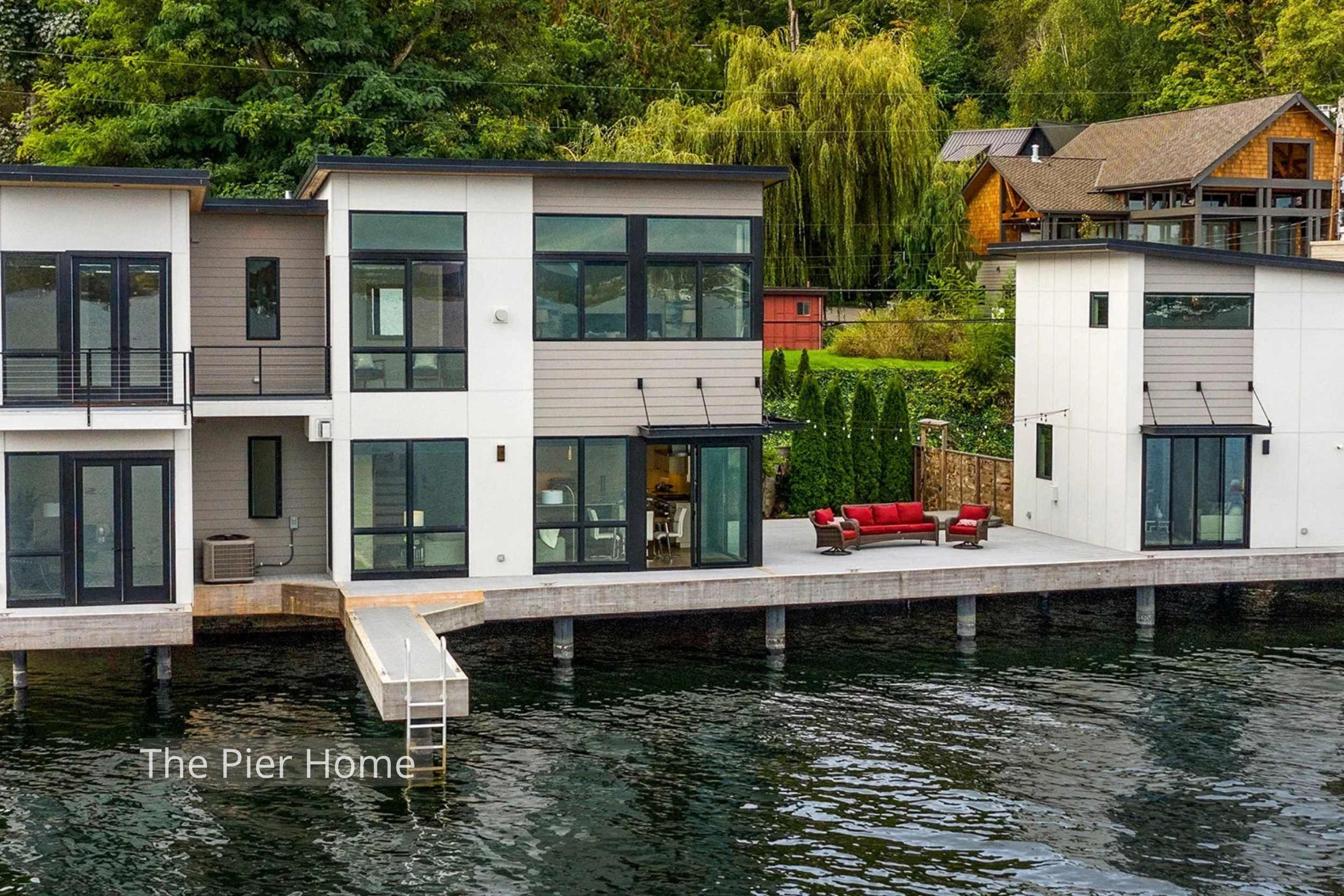 This Lake Washington New Home by ECCO Architecture features a modern waterfront residence designed to maximize lake access and outdoor living. Clean-lined volumes, expansive glazing, and direct dock connections create a seamless relationship between 