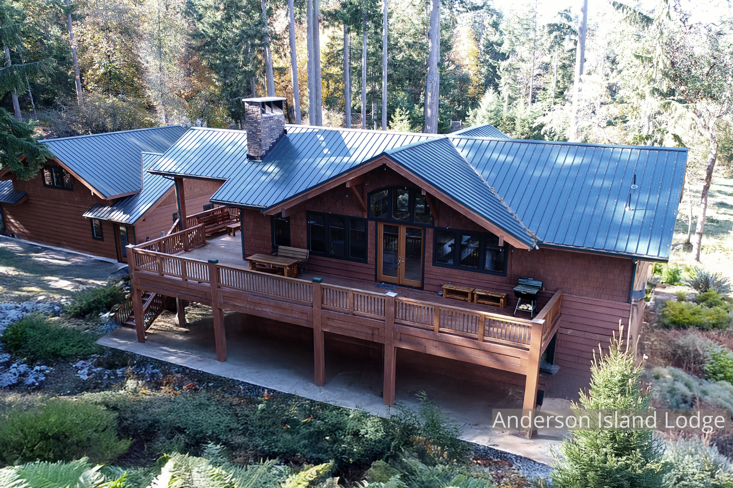 A handcrafted timber home by ECCO Architecture on Anderson Island, designed as a summer retreat for a Texas family with Pacific Northwest roots. The home’s structure and finish carpentry were milled from trees cleared on-site, creating a direct conne