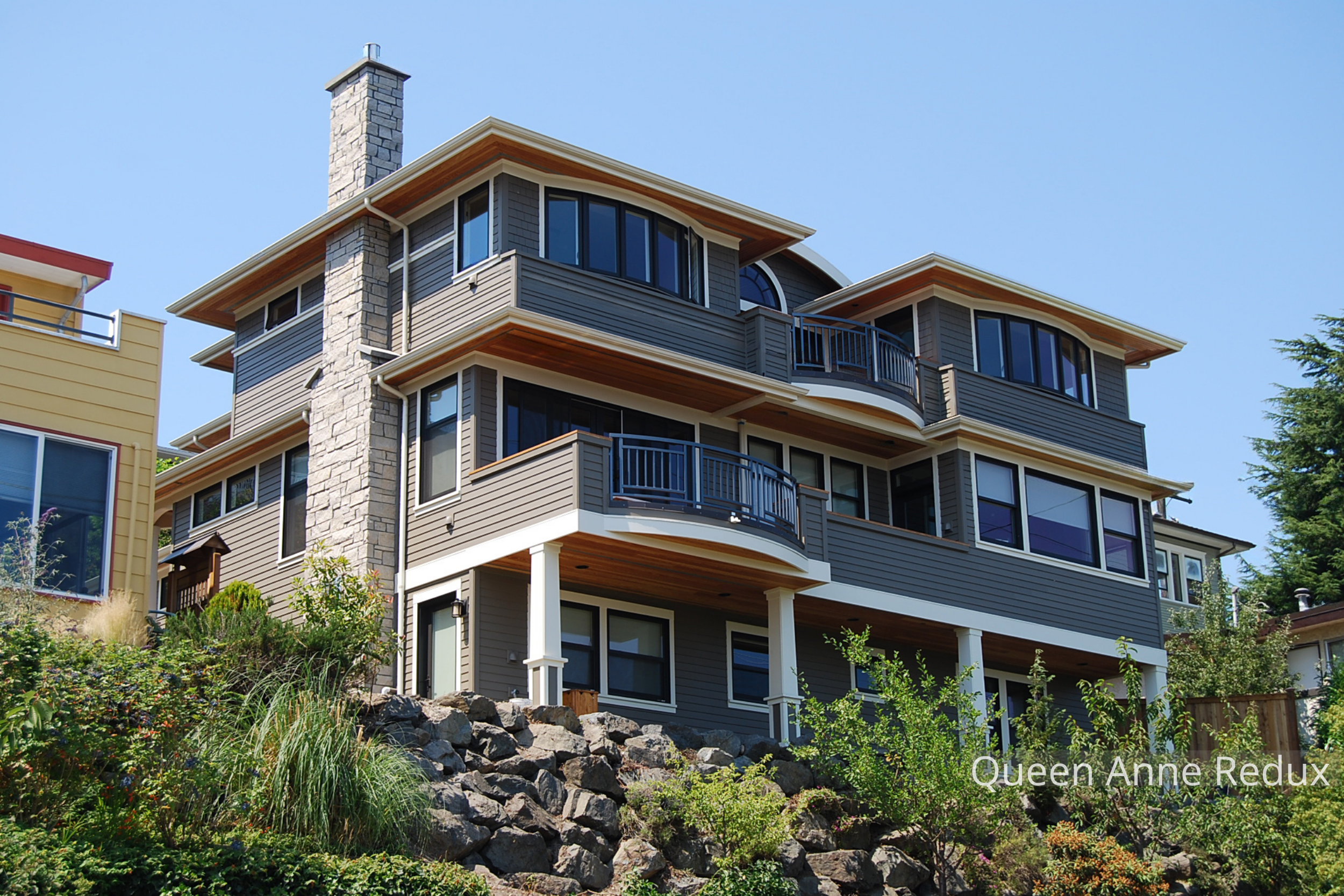 The Queen Anne New Home by ECCO Architecture maximizes its sweeping views of Lake Union and Downtown Seattle with a curved upper deck designed for relaxation and connection. This elevated outdoor space blends Craftsman-inspired detailing with contemp