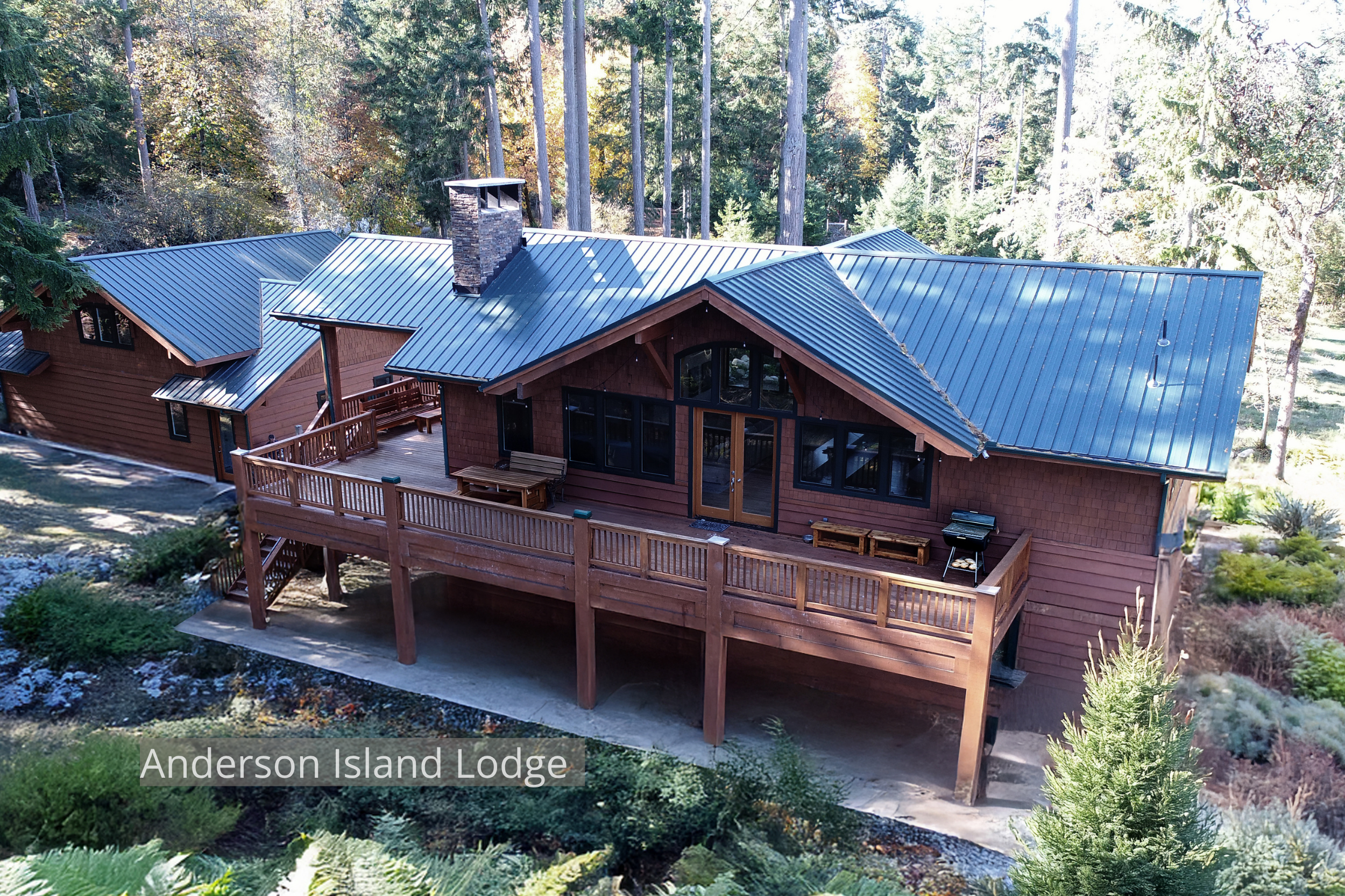 A handcrafted timber home by ECCO Architecture on Anderson Island, designed as a summer retreat for a Texas family with Pacific Northwest roots. The home’s structure and finish carpentry were milled from trees cleared on-site, creating a direct conne