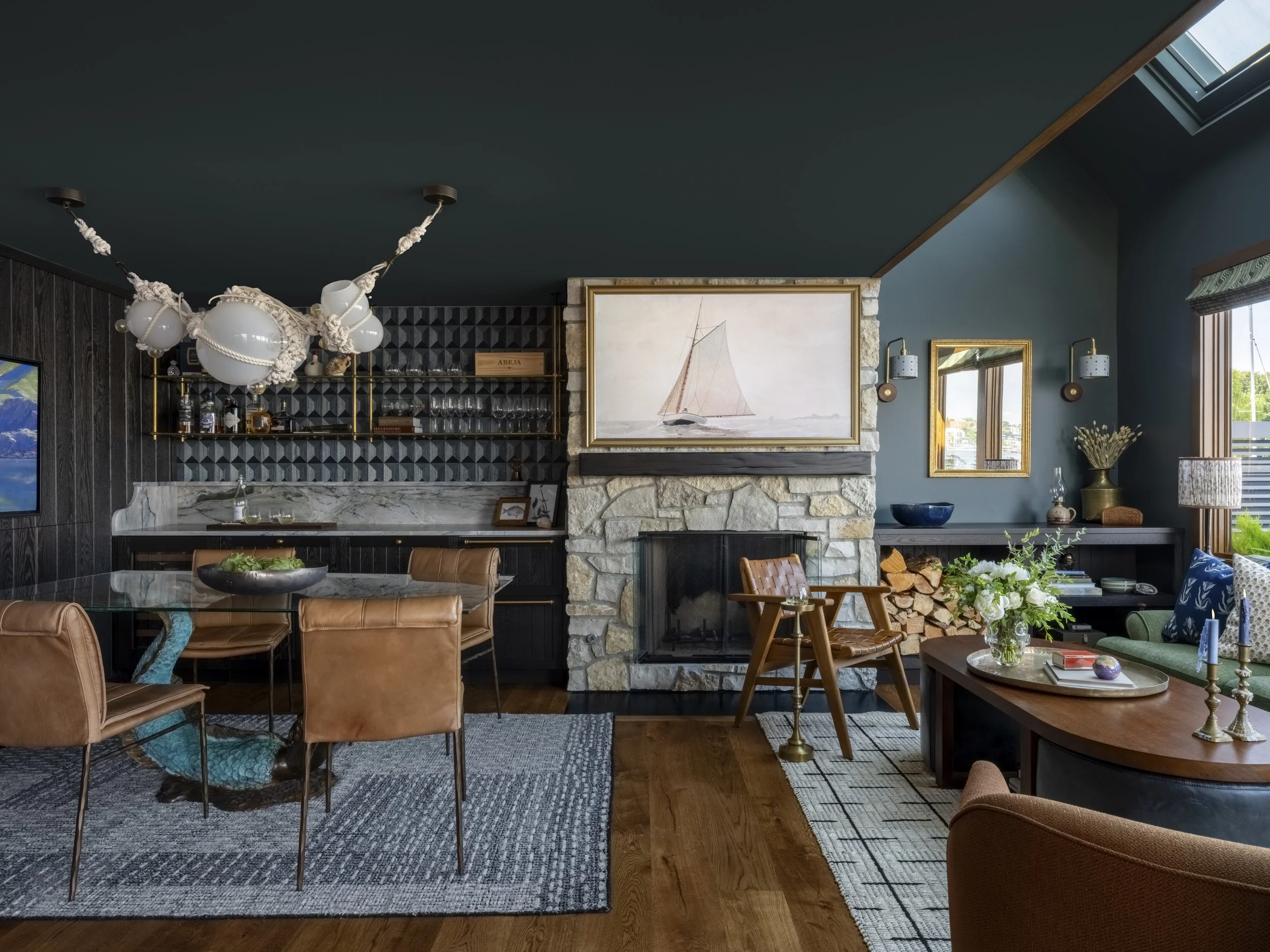 Nesika Chuck Floating Home | Seattle, WA

Contemporary kitchen and living space with tile fireplace surround, layered lighting, and seamless indoor–outdoor connection.