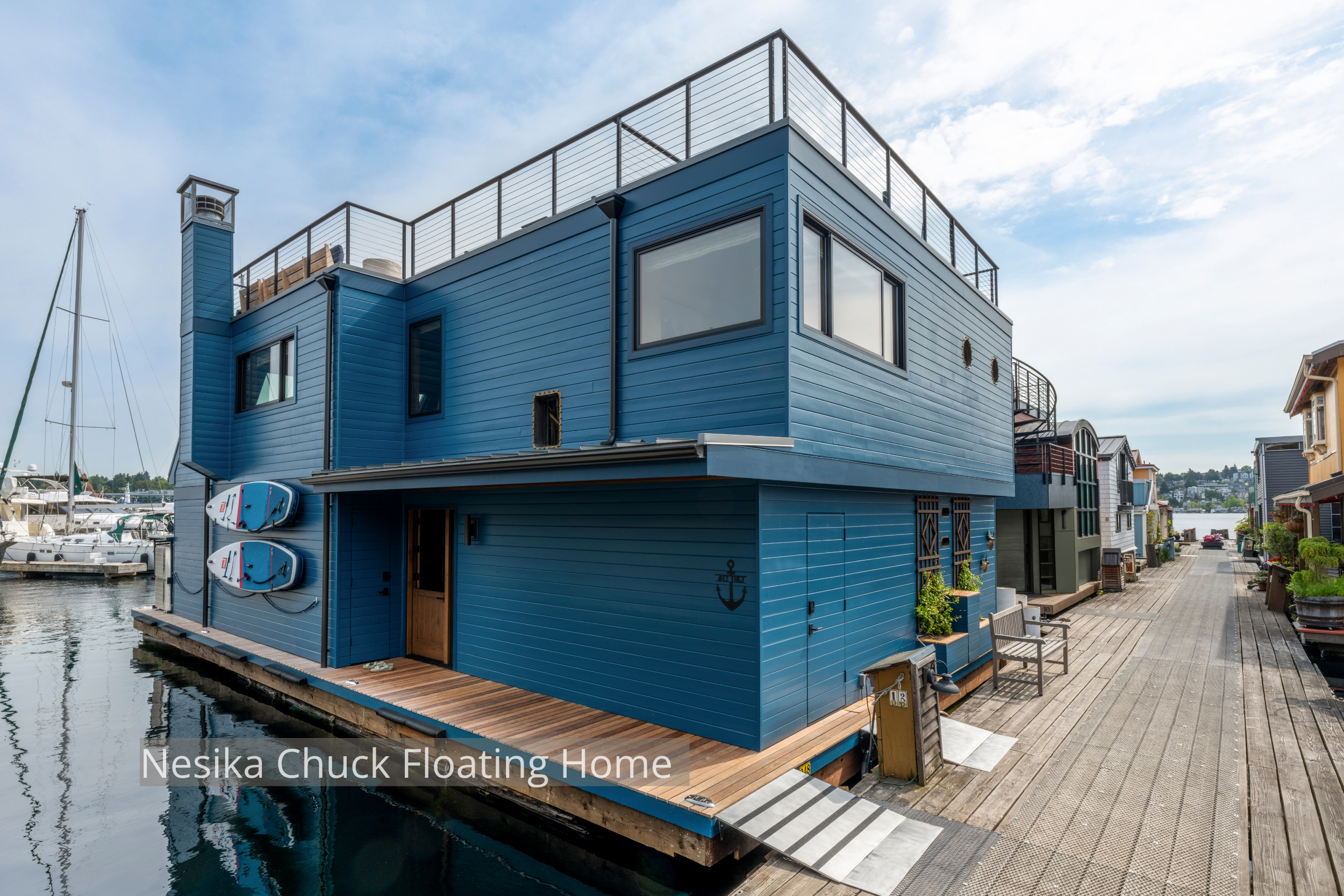 Nesika Chuck Floating Home | Seattle, WA

A modern floating home on Lake Union designed for light, views, and seamless indoor–outdoor living. Clean contemporary lines, rooftop deck access, custom millwork, and exposed wood detailing create warmth wit