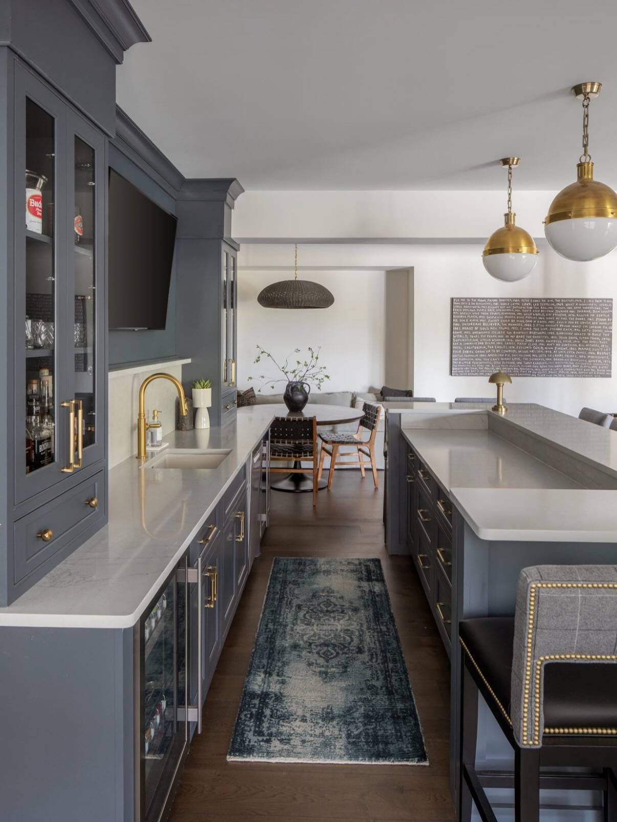 A bar that offers that offers this much storage and still looks cool doing it? Sign me up! ✋ 
.
.
.
#cincinnaticustomcabinetry #darkandmoodybars #storage