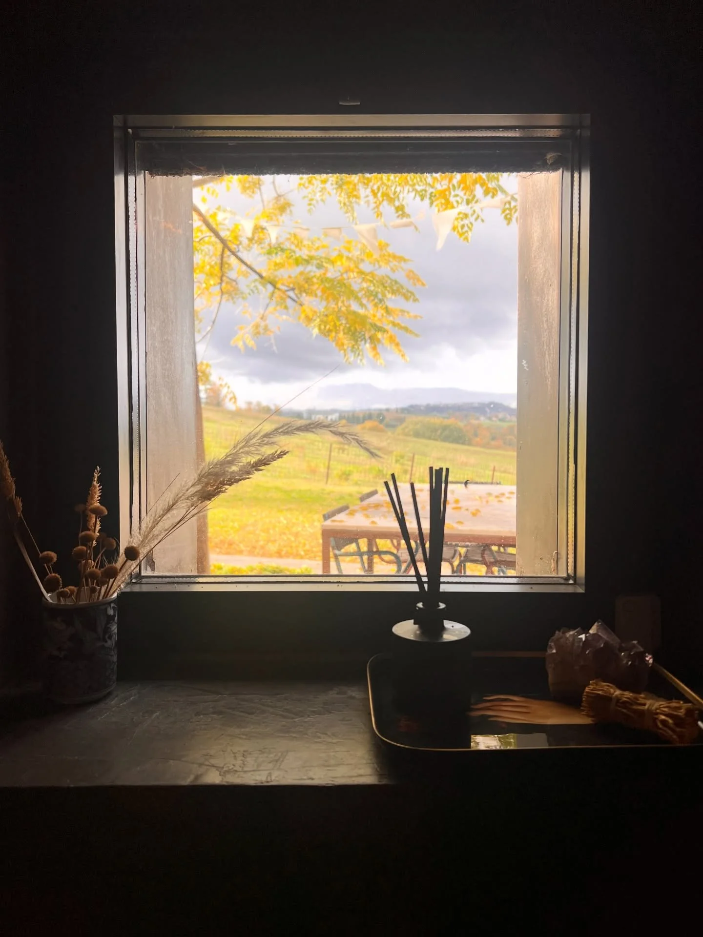 A moody autumn sky seen through the little window in the powder room. #agradolce #casasulchiaro #umbria #italy