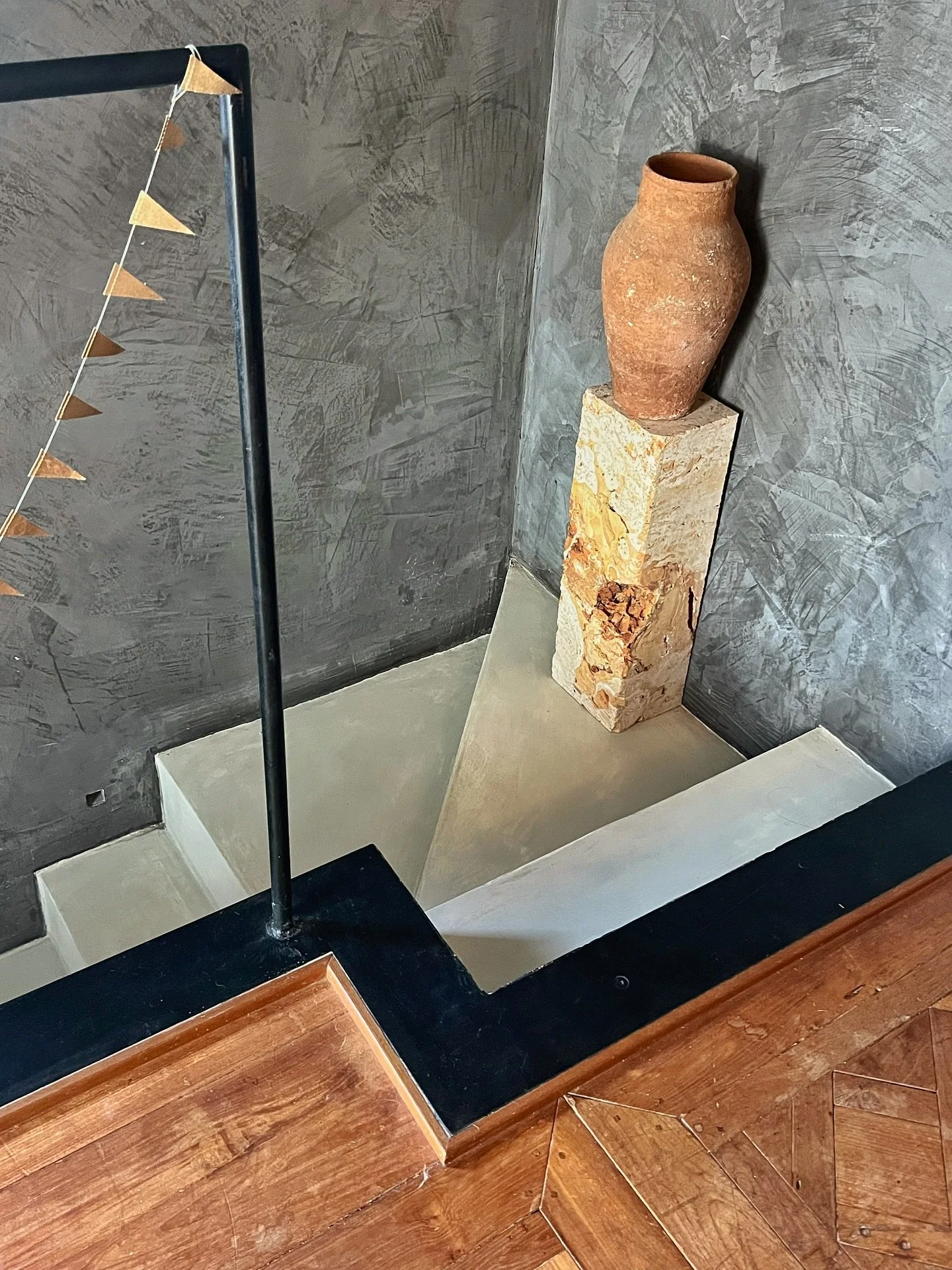 Last of the studio feature. This one showing some other small corners of the room. The angled staircase leading up to the space with the raw block of travertine plinth. The platformed niche over the stairs for a collection of books and objects. The v