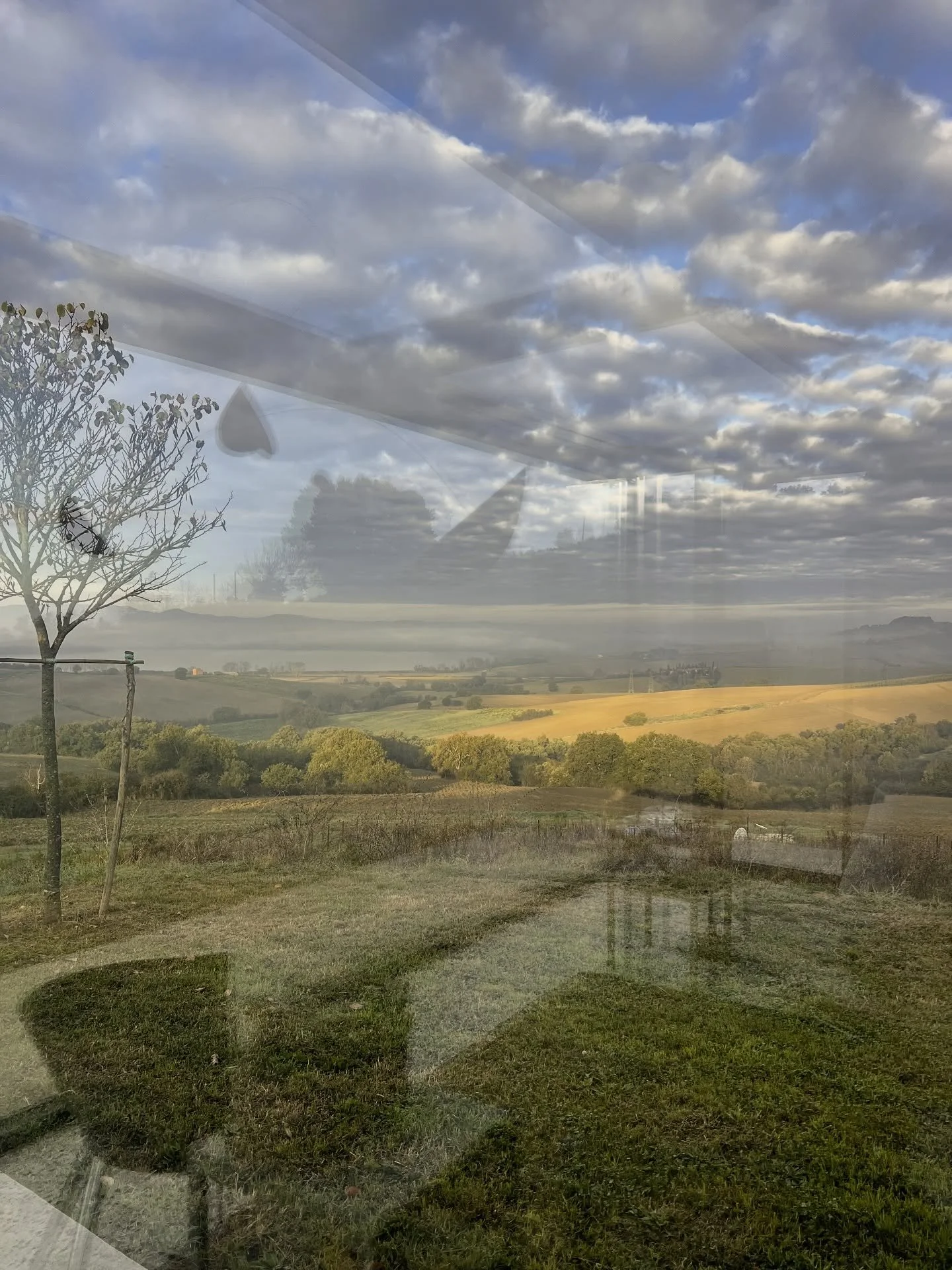 Soft morning reflections over the light mist just after sunrise. I loved the glow of the newly plowed fields. #umbria #italy