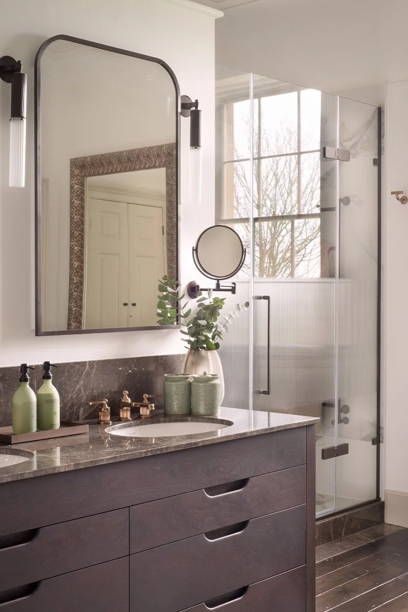 Georgian manor master ensuite with bespoke double basin vanity and mirror storage.