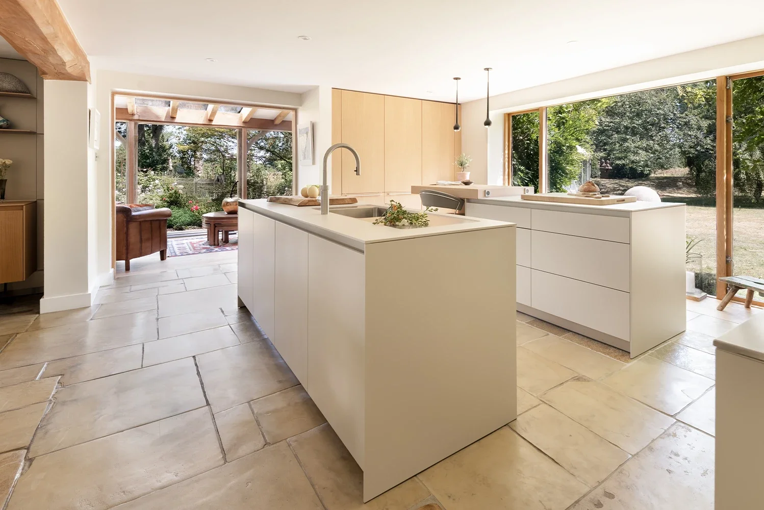Open-plan bulthaup kitchen with two islands and garden views