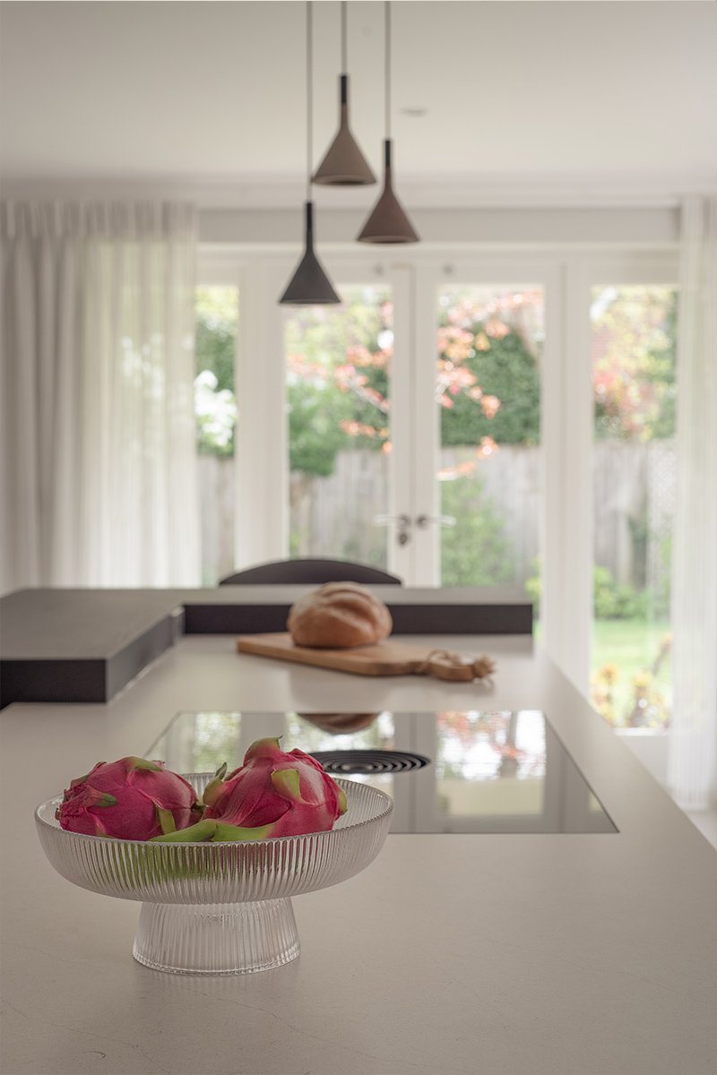 Bulthaup kitchen island with integrated BORA hob and minimalist handleless cabinetry