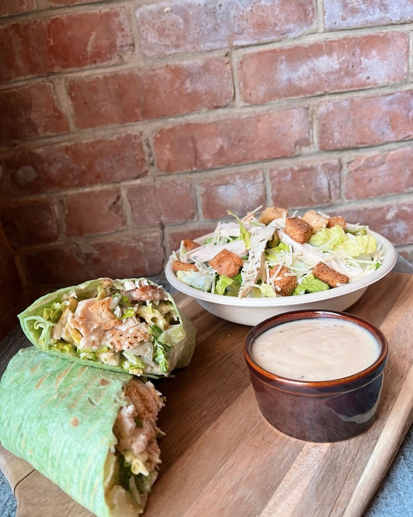 It&rsquo;s never to early to be thinking about lunch ‼️ Try our Caesar Salad or Chicken Caesar Salad Wrap. Available at both our locations too. Happy Tuesday 🌞☕️ #foodies #lunchideas #salads #wraps #paninis #flatbreads #tuesdayvibes #patioweather
