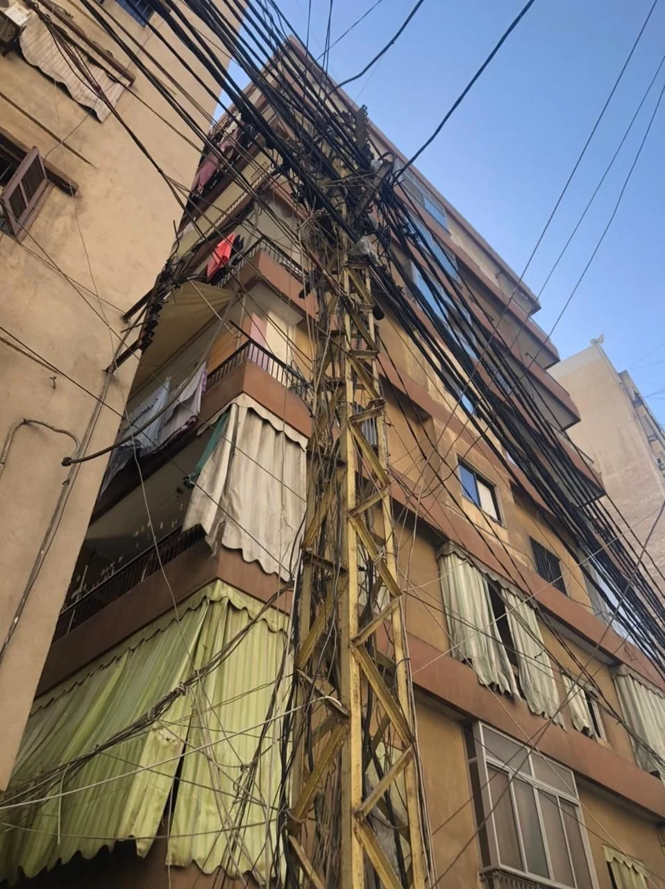 Exposed cables on a utility pole. Photo&nbsp;by author.