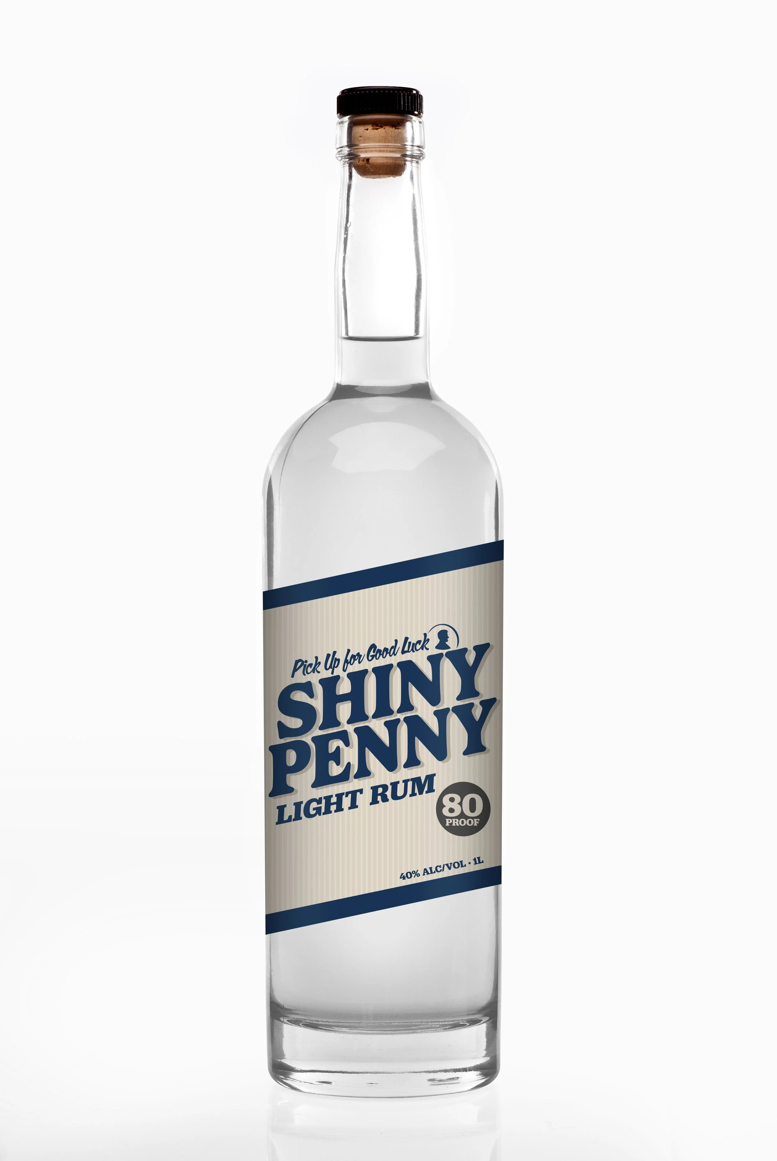 Bottle of Shiny Penny Light Rum with a cork, 80 proof, labeled as 40% alcohol by volume, and 1 liter in size.