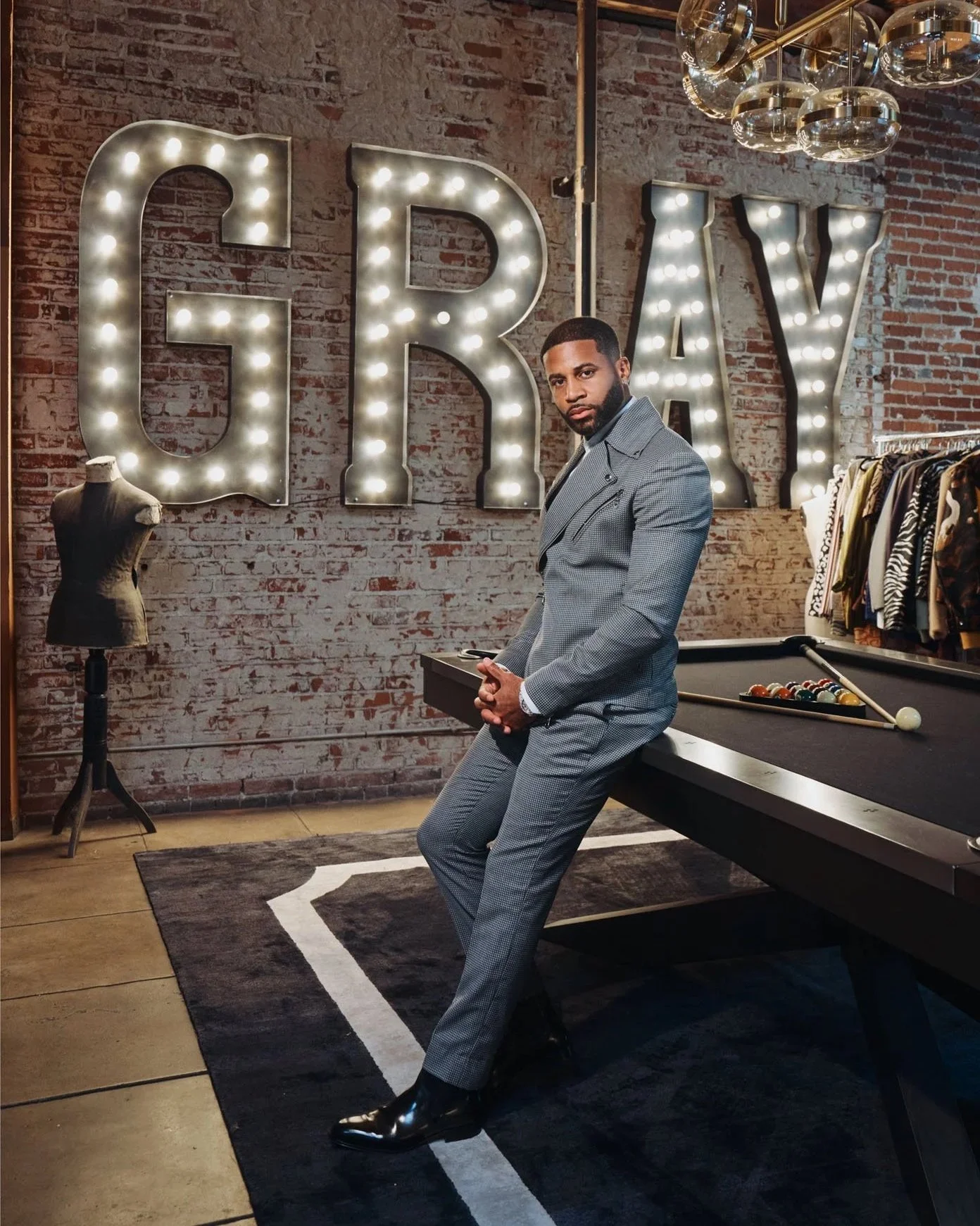 MattEllis-Portraits-Devale-Ellis-in-gray-suit-by-pool-table-in-grayscale-studio-LA_326.jpg