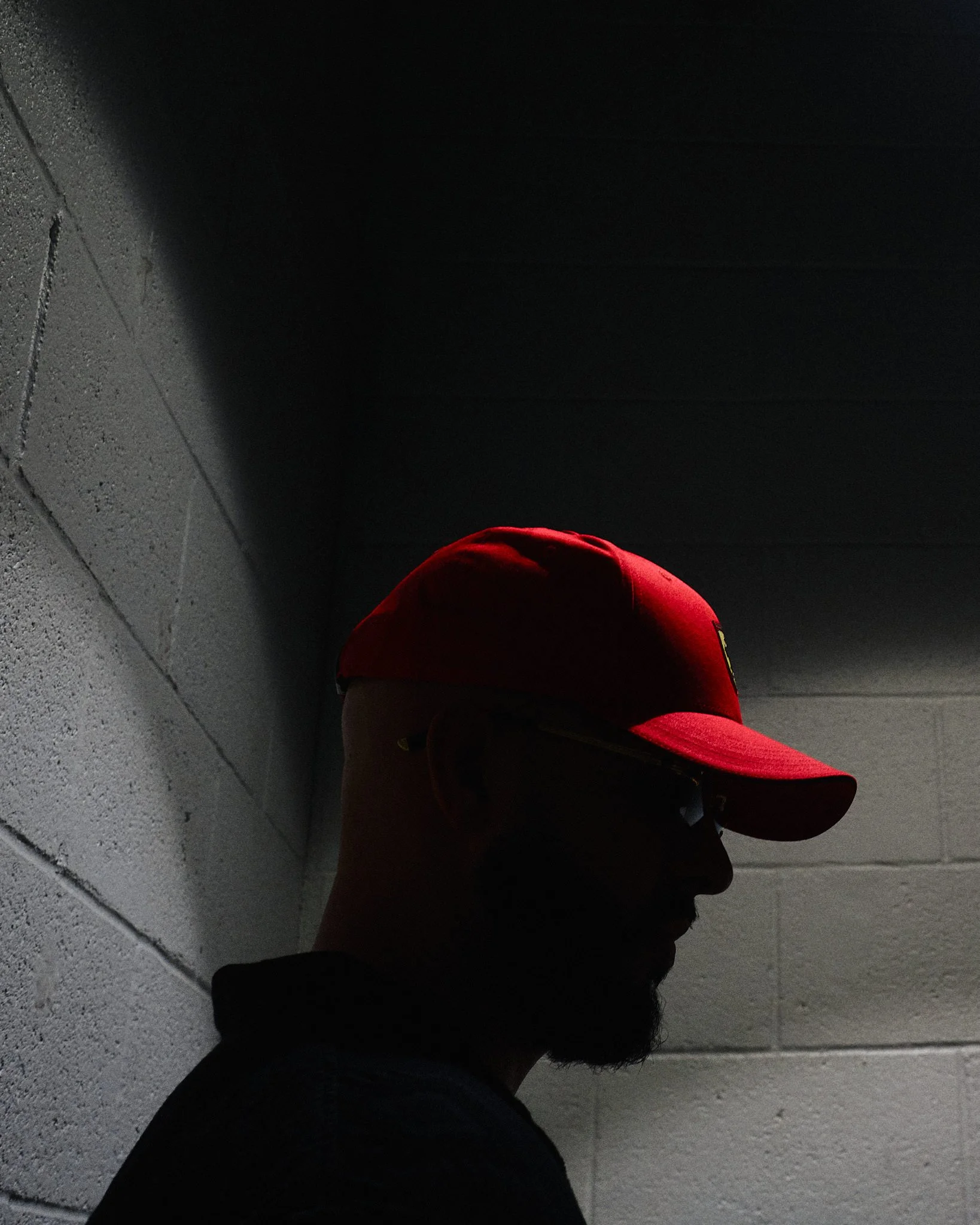 Mattellis-Man-Red-Cap-Silhouette-Concrete-Wall.jpg